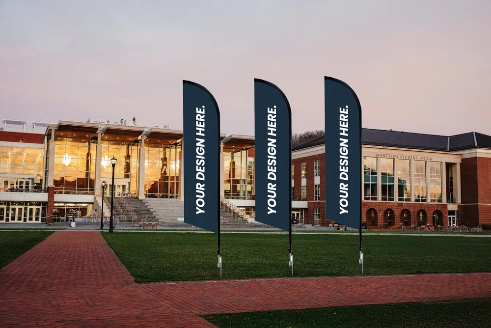 Three vertical feather flags printed with Your Design Here