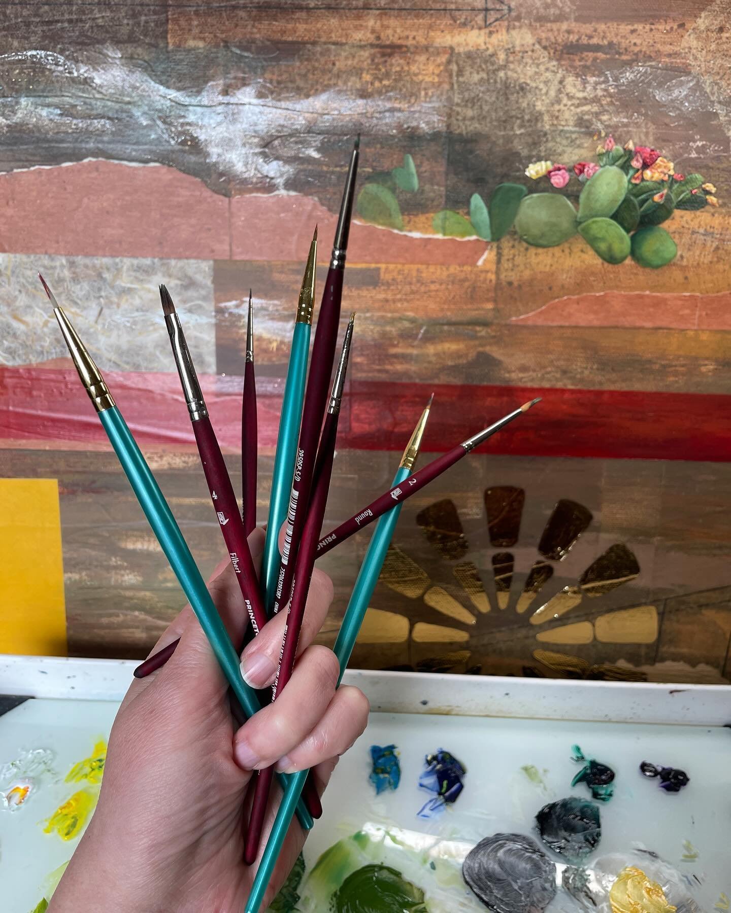 Finally, back in the studio! A few hours of intense focus and I look down to see my left hand has become a pretty crazy brush holder for all the tiny brushes I keep switching between. No wonder these cactus are taking so long to paint. Maybe I should