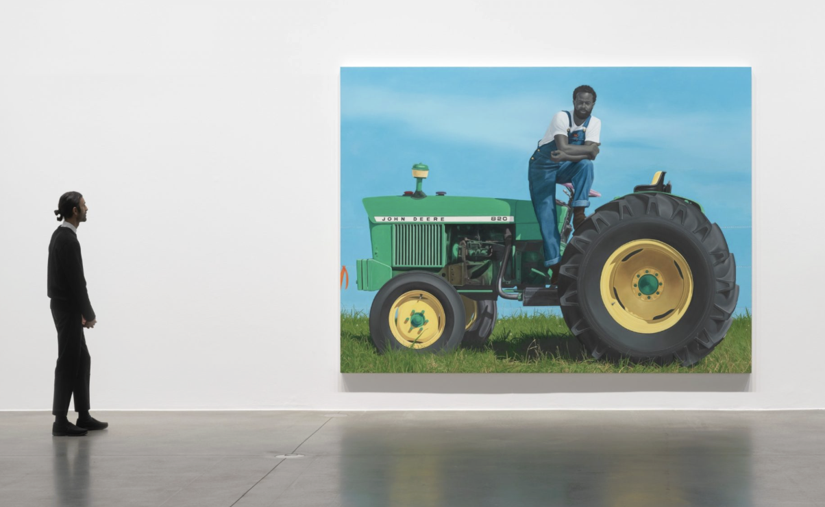 —Denzel Mitchell, Jr. is the farmer in Amy Sherald’s ‘A God Blessed Land (Empire of Dirt)’, on view at the Baltimore Museum of Art through April 5. Denzel is the Executive Director of the Farm Alliance of Baltimore.