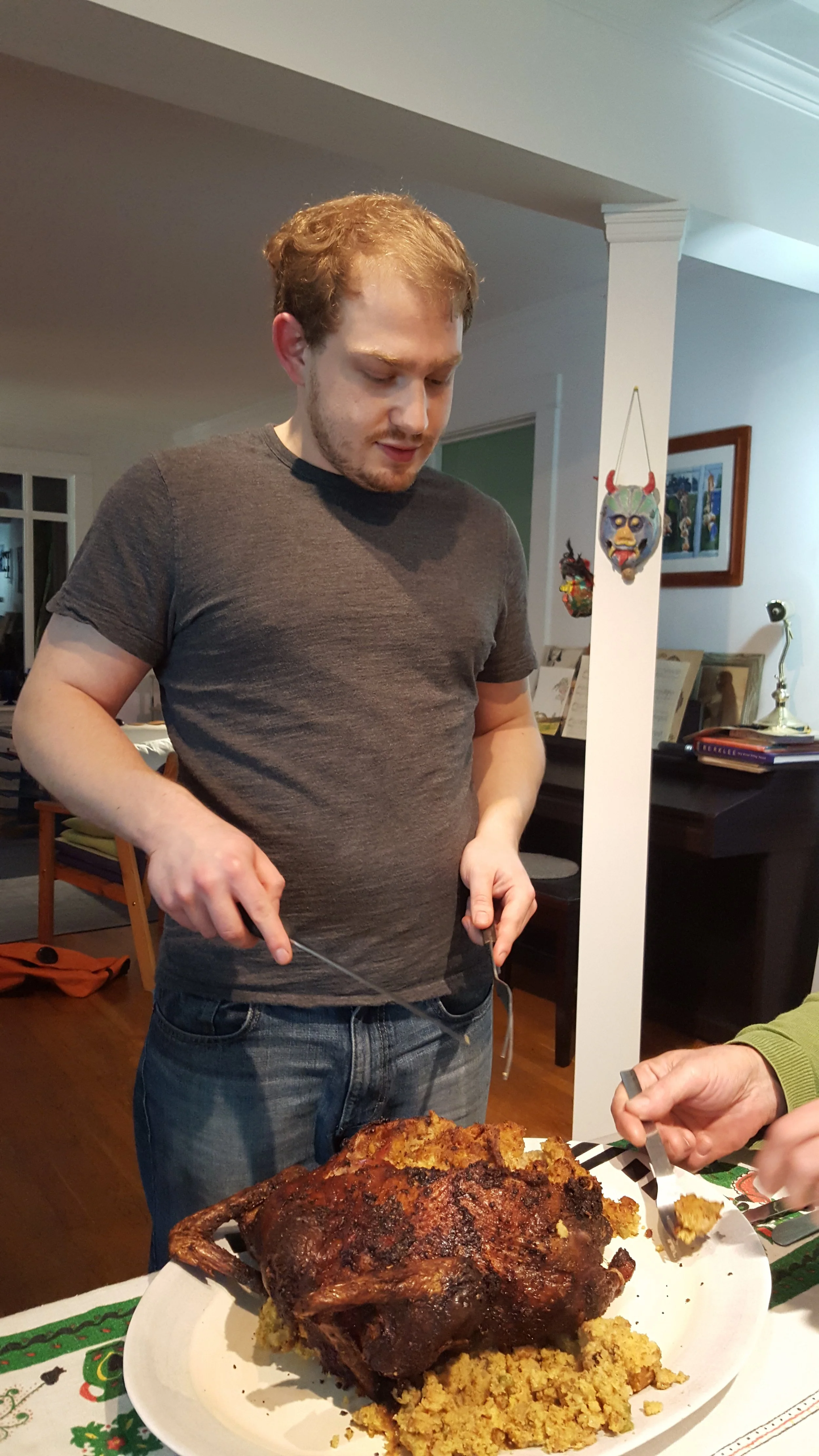 Noam carving the duck