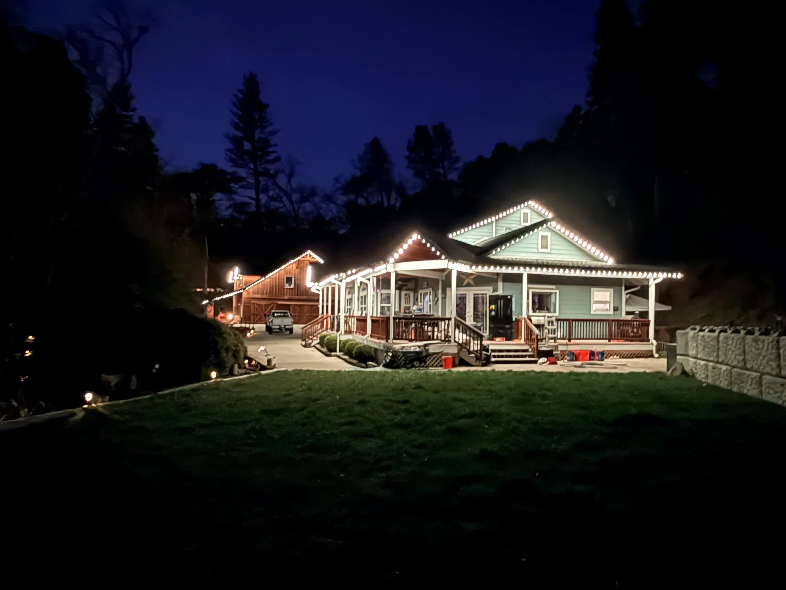 Beautiful home in Placerville, CA illuminated at night with LumaGlow permanent LED roofline lighting.