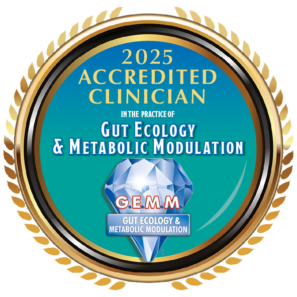 A round badge with a gold leaf border and black inner border. Inside, it says '2025 Accredited Clinician in the Practice of Gut Ecology & Metabolic Modulation' with a blue diamond graphic at the bottom labeled 'G.E.M.M. Gut Ecology & Metabolic Modulation'.