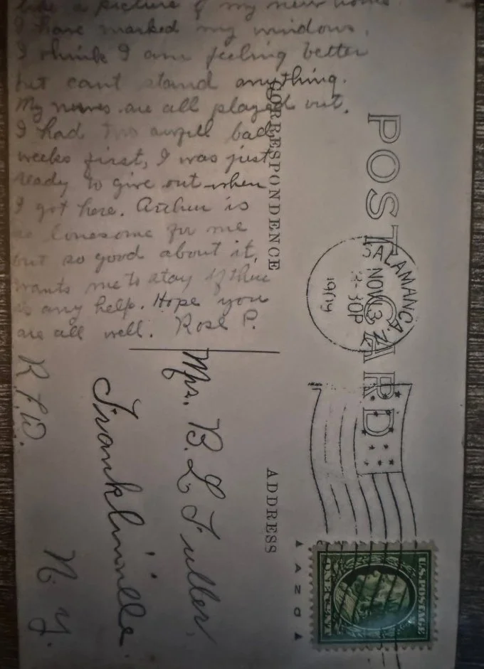 A handwritten postcard with a message on the left side and postage stamps on the right. The message discusses feeling better, not being able to stand, and hopes for the recipient's well-being. Postmarks and address details are also visible.