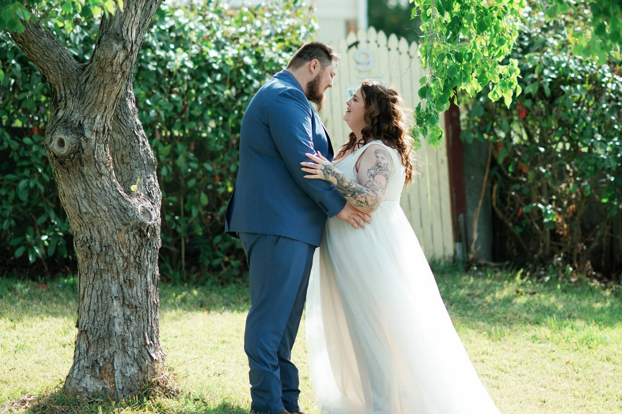 Bride and Groom Candid Moment Under Tree at Stockade Hill Heritage Park Wedding