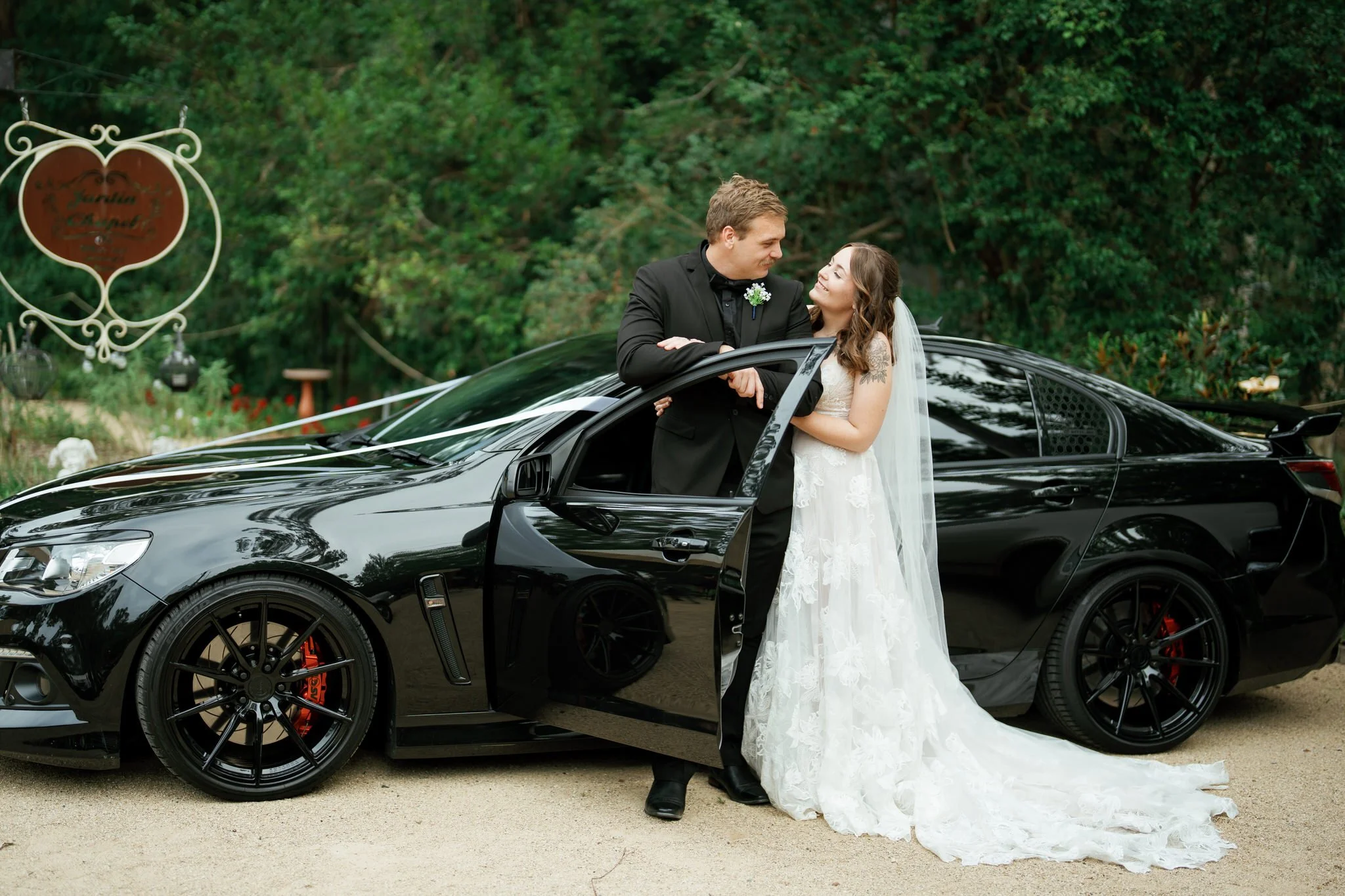 Bride and Groom Relaxed Wedding Car Portrait at Kangy Gardens