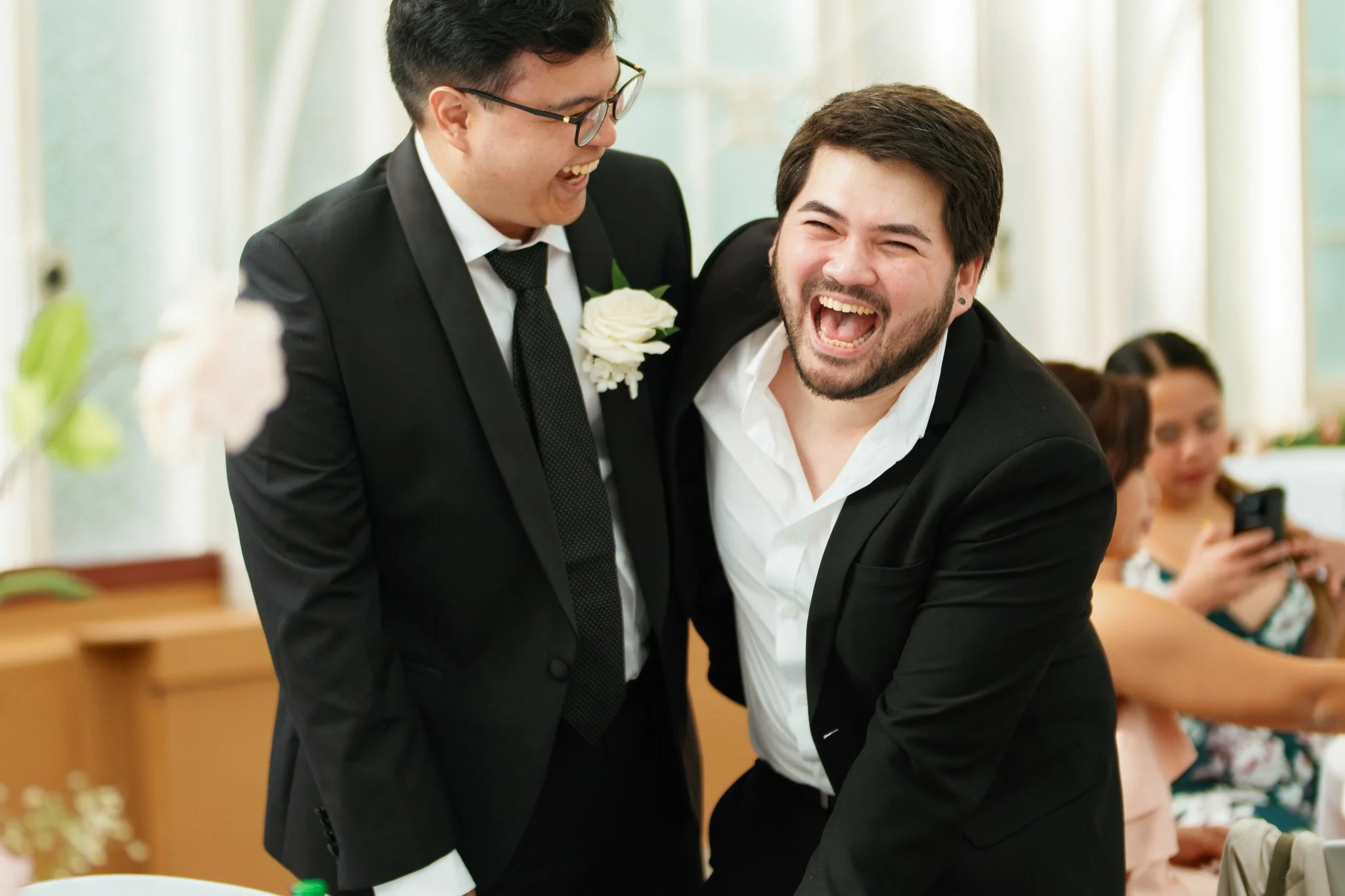 Groom Laughing with Guest at Palm House Reception – Botanic Garden Sydney
