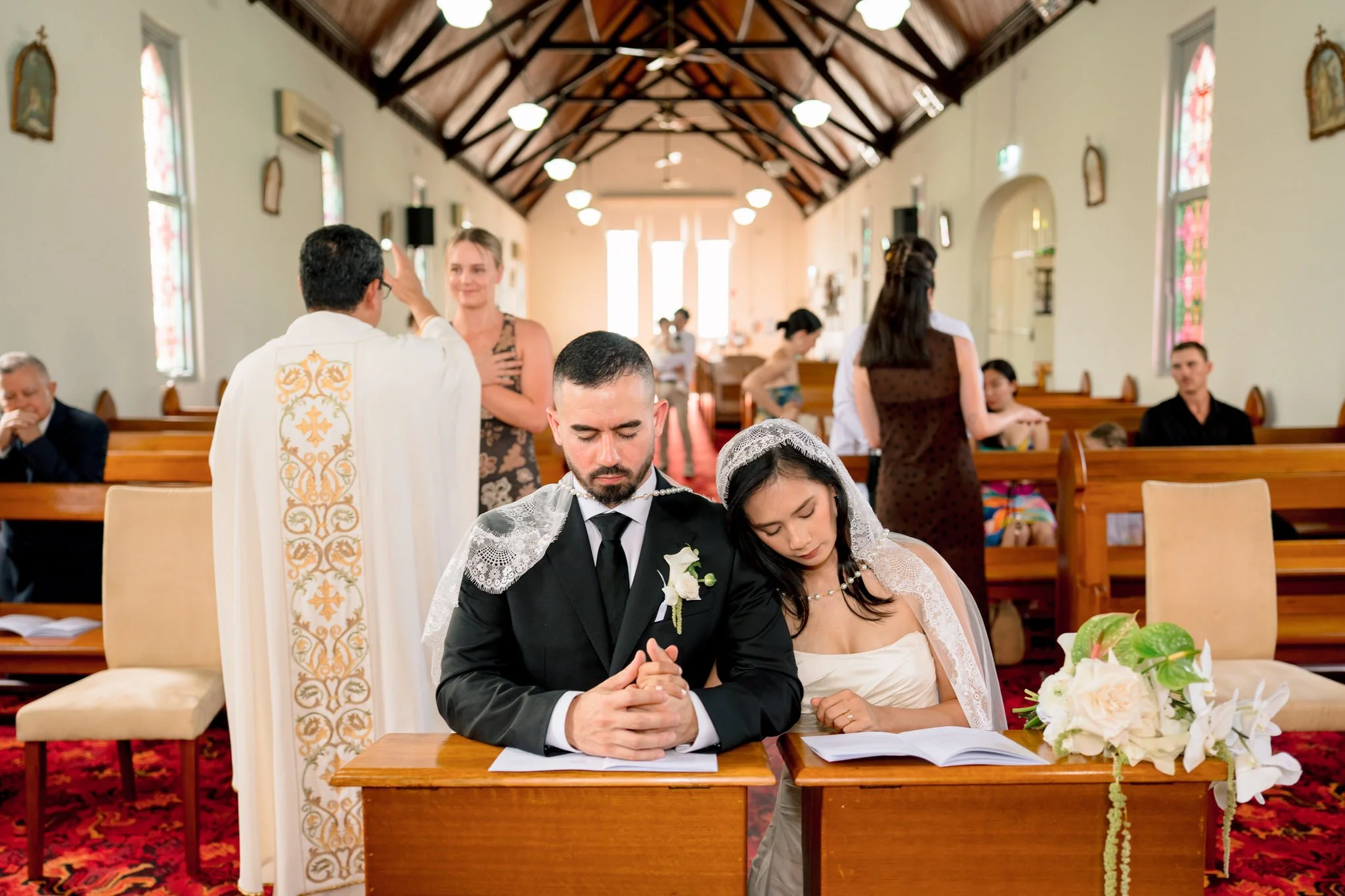 Couple praying during communion