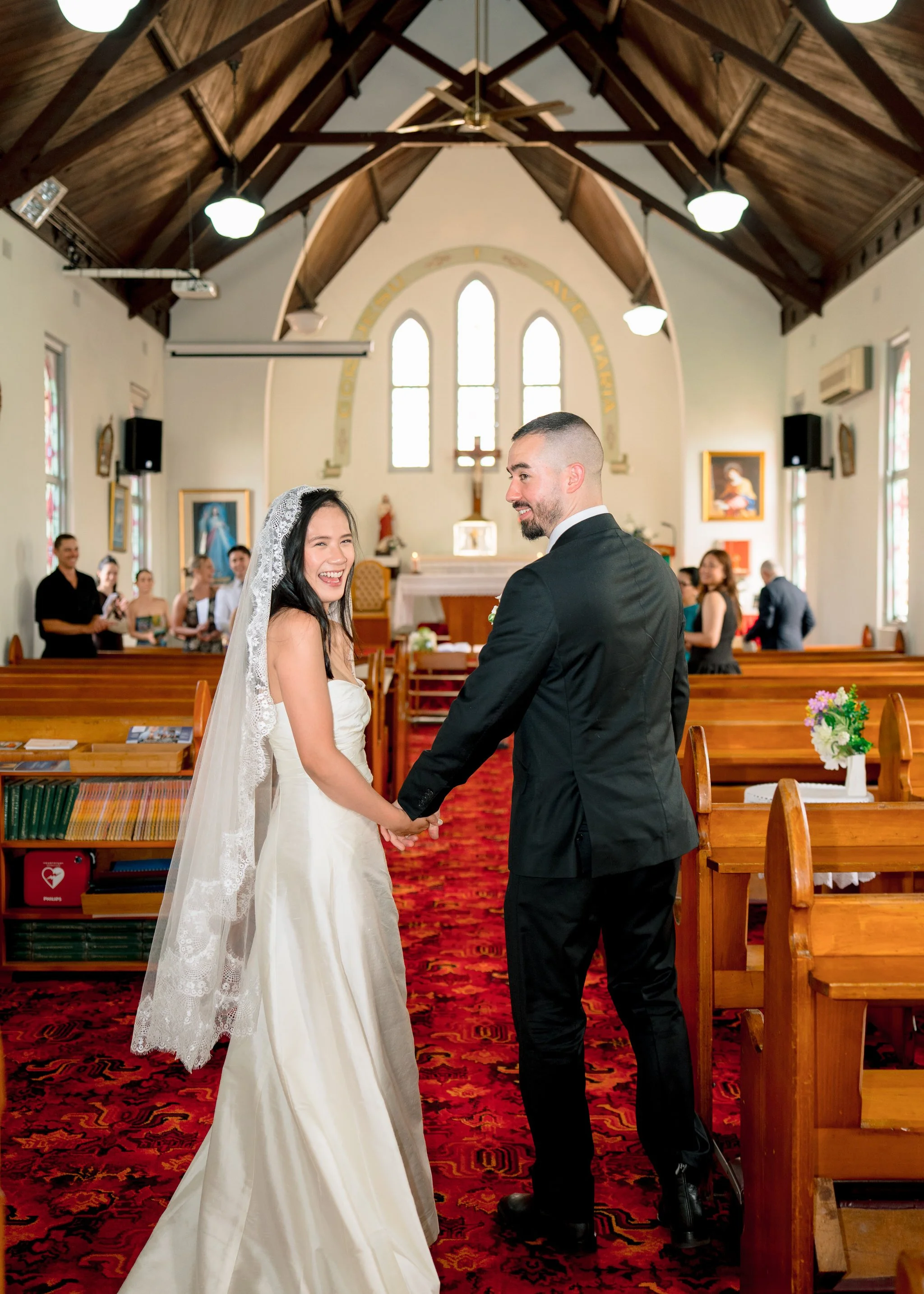 St Cecilias Wyong wedding couple in aisle