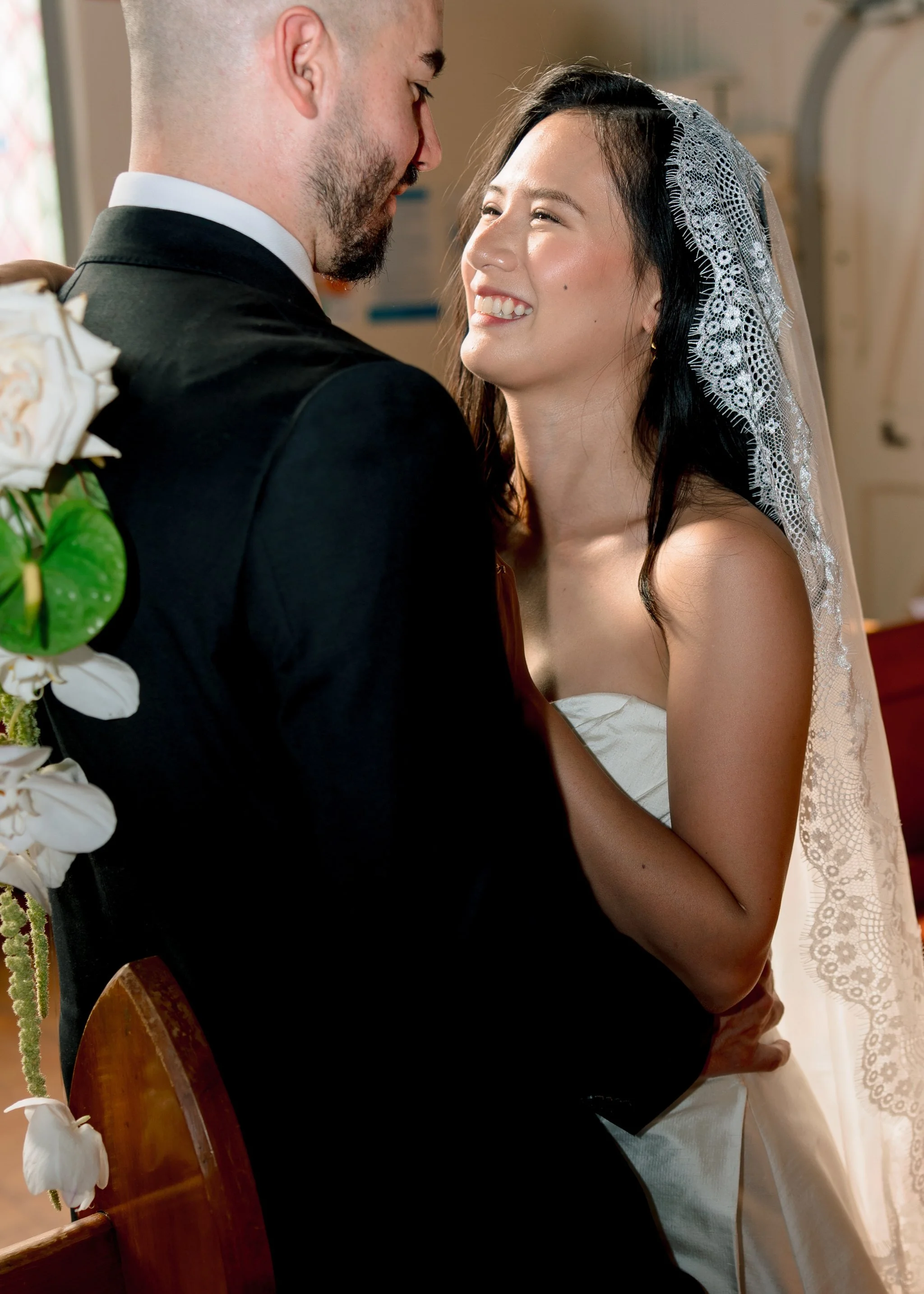 Bride smiling with groom inside St Cecilias Church