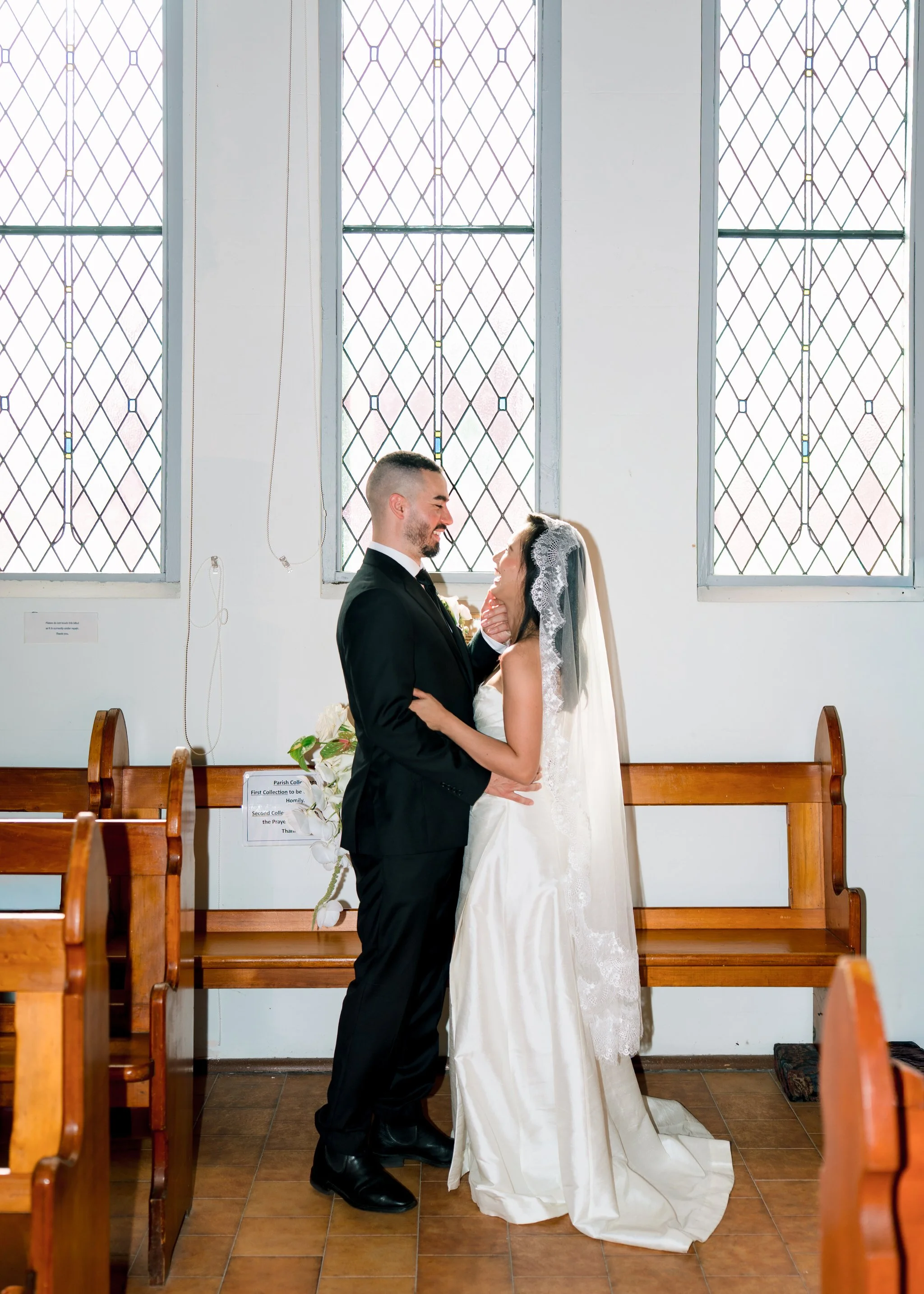 Couple portrait by stained glass windows Wyong