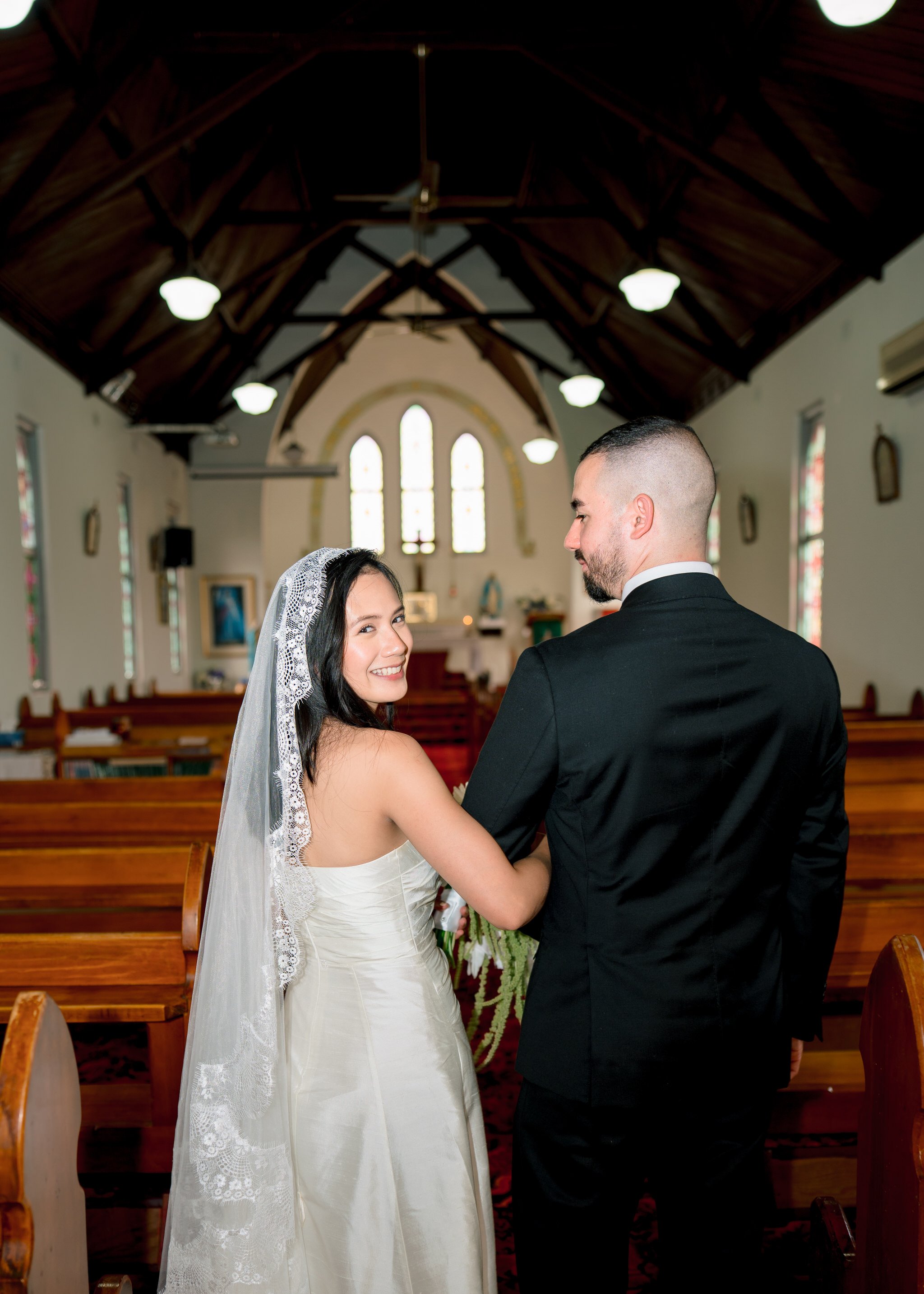 Bride smiling back St Cecilias Church