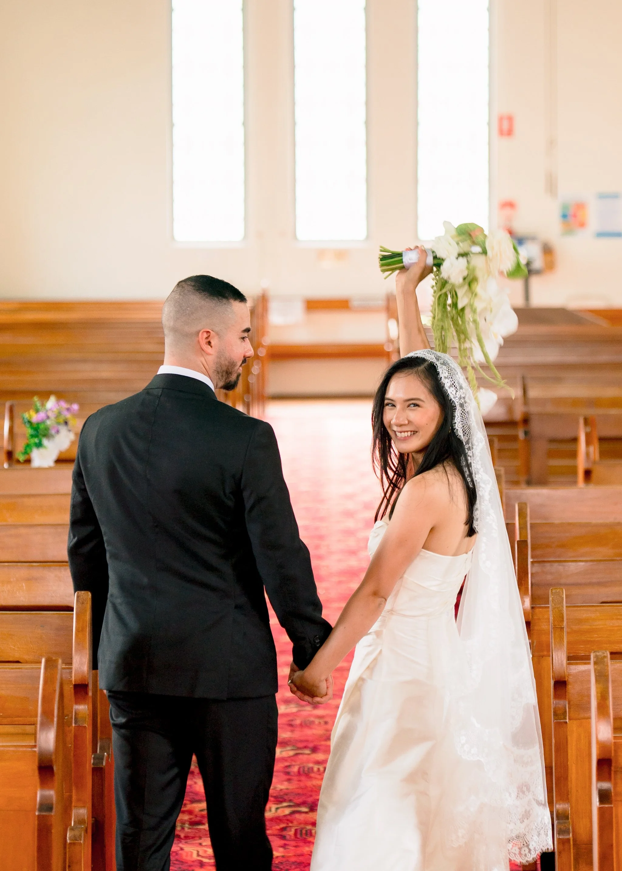 Bride celebrating with bouquet St Cecilias