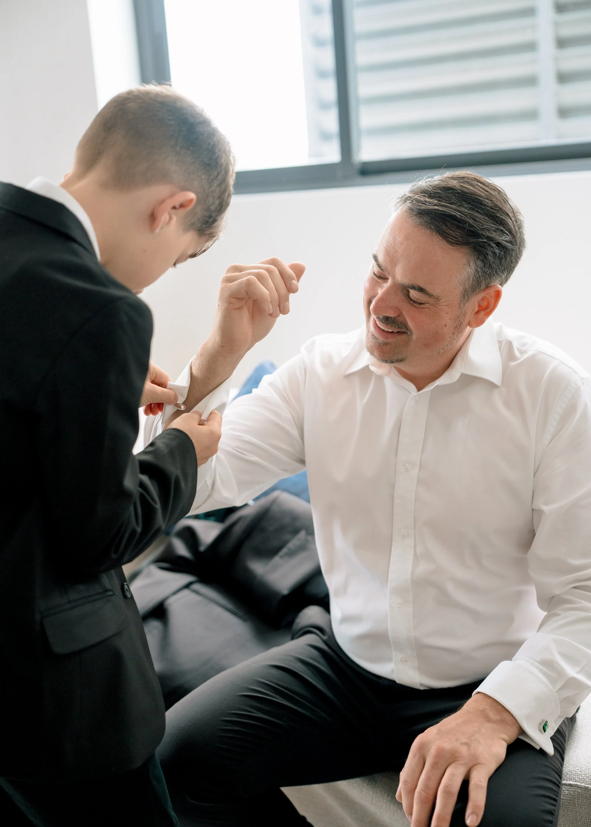 Groom and son getting ready moment