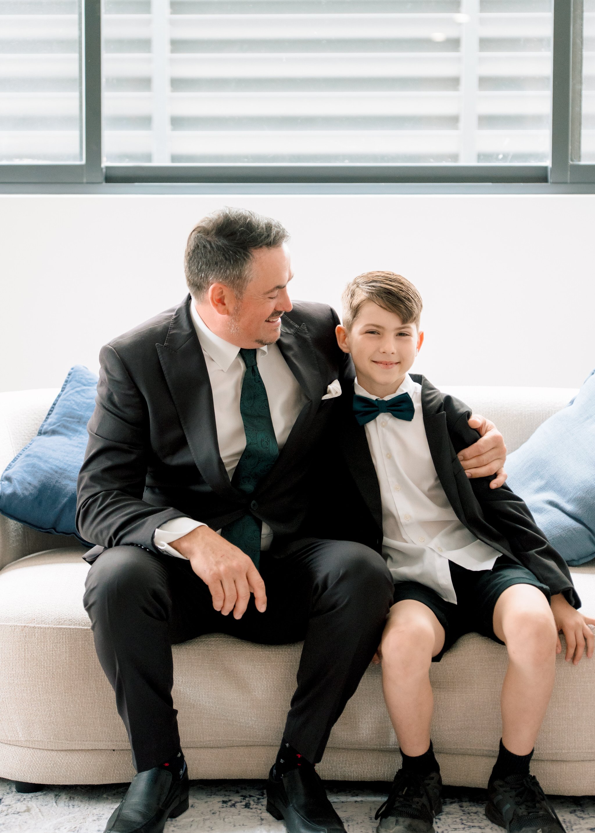 Groom and son wedding preparation moment