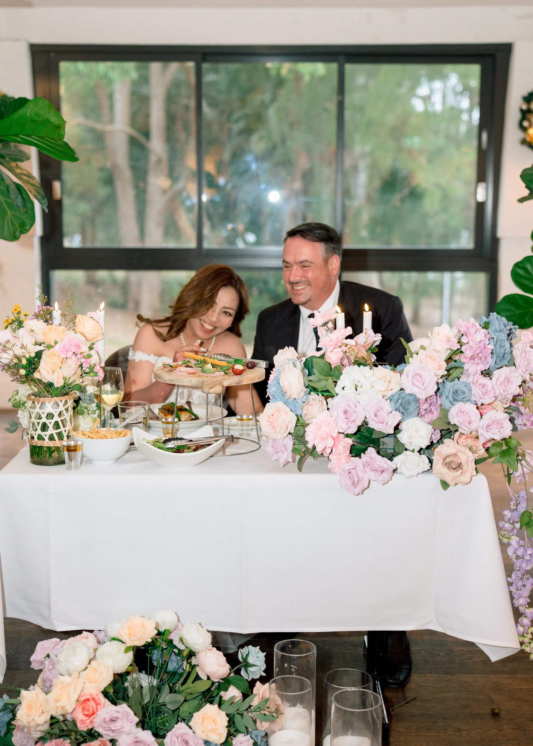 David and Anna seated at reception
