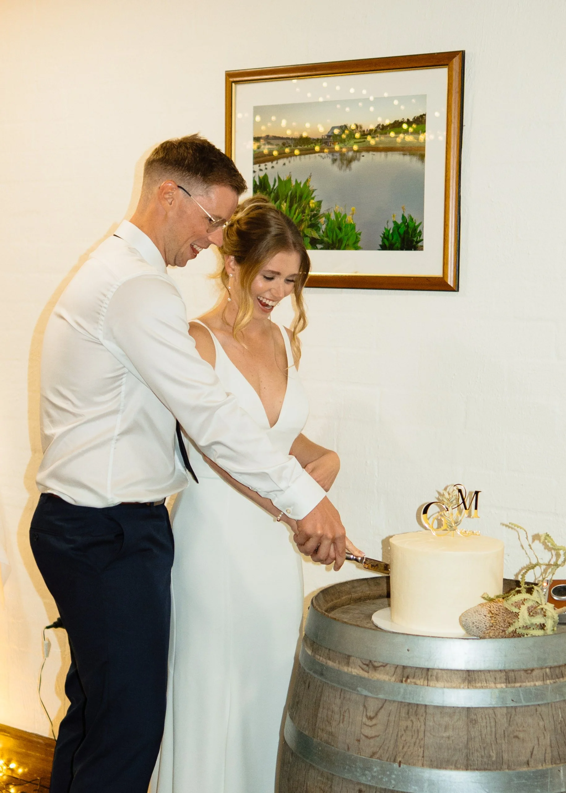 The couple share their first dance surrounded by family and friends at their Hunter Valley Gardens wedding reception. A relaxed, joy-filled moment captured naturally.