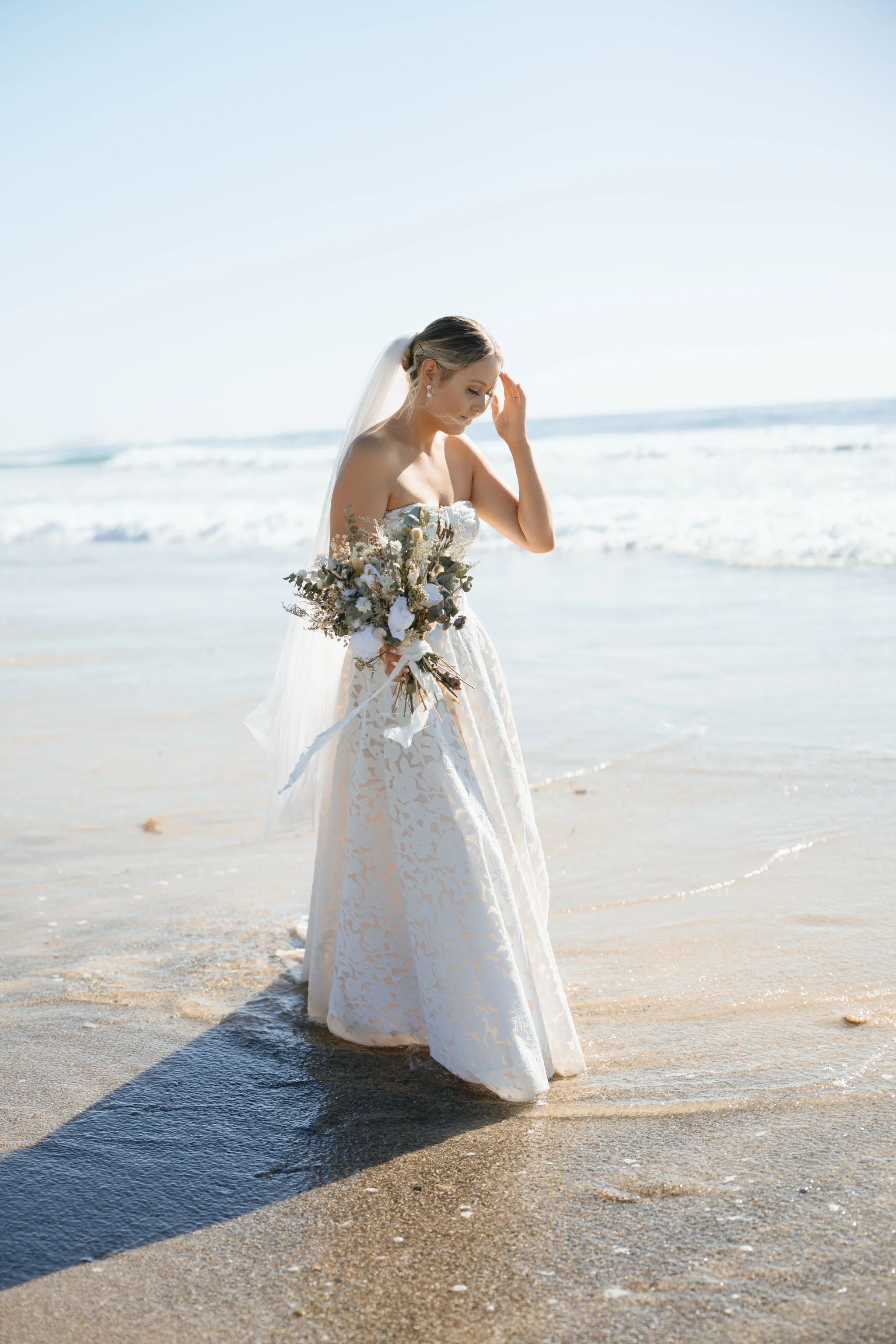 caves-beach-wedding-bride-portrait-water