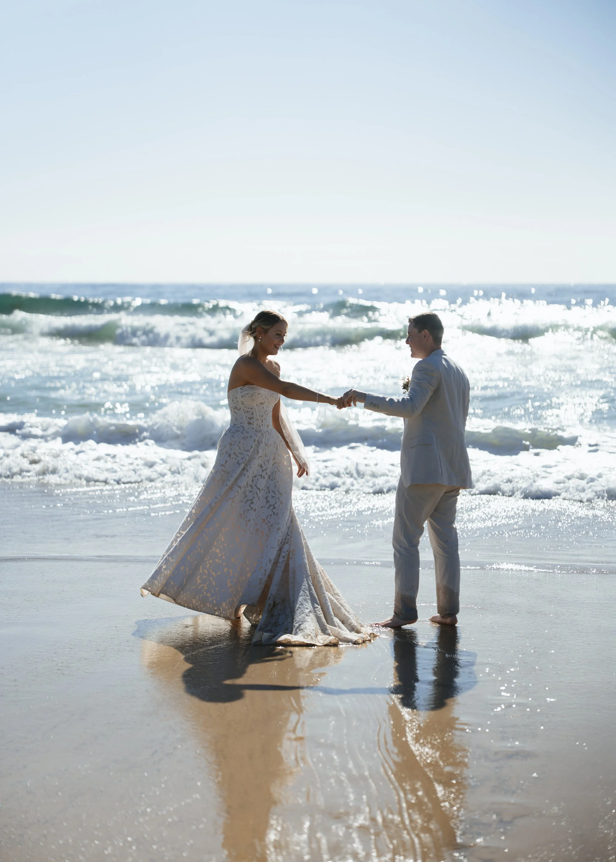 caves-beach-wedding-couple-spin-water
