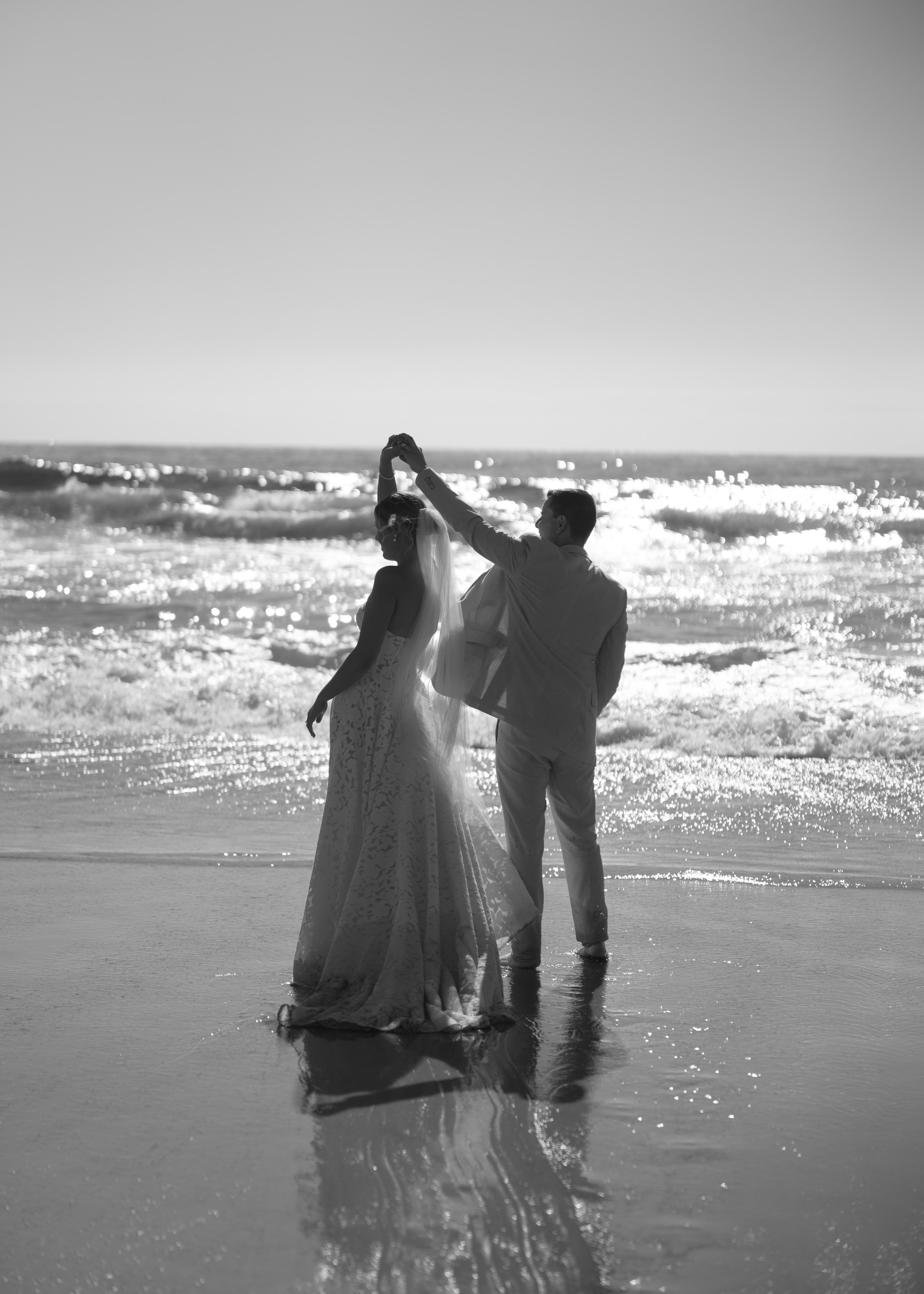 caves-beach-wedding-couple-dance-silhouette