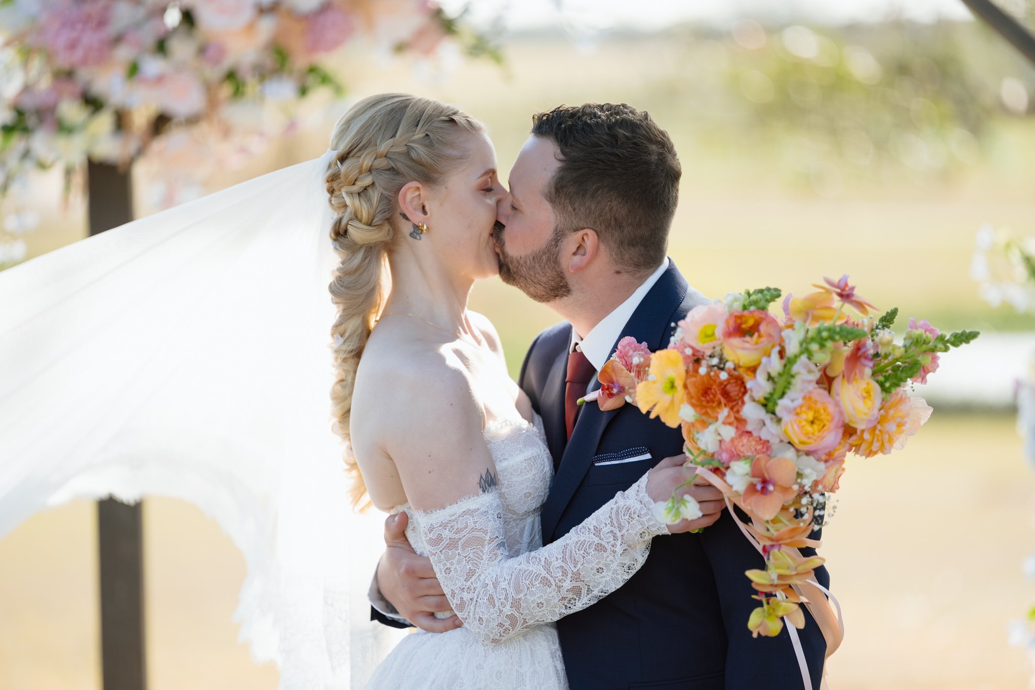 Newlyweds Kissing at Squire's Vineyard