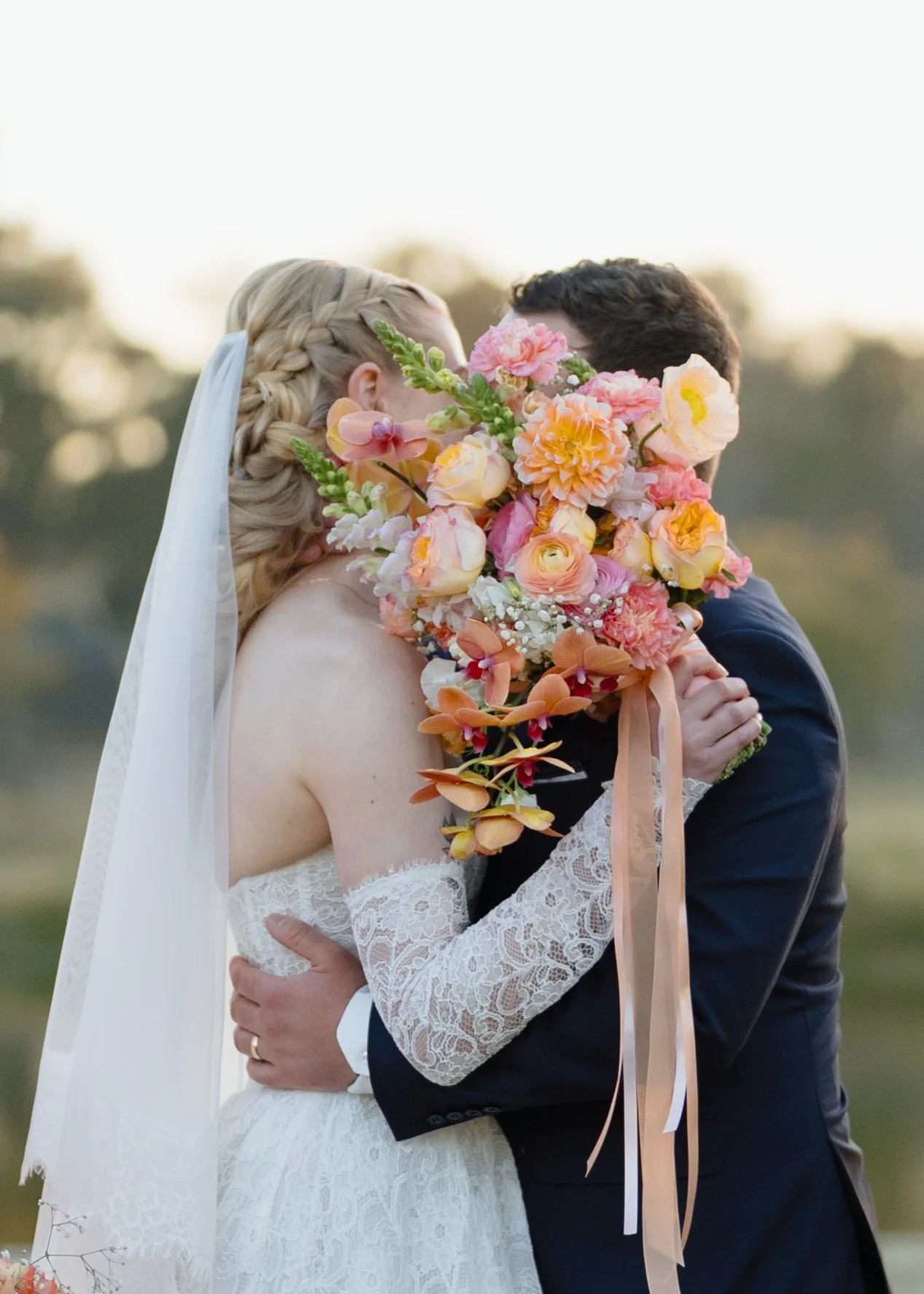 Bride and Groom Behind the Bridal Bouquet