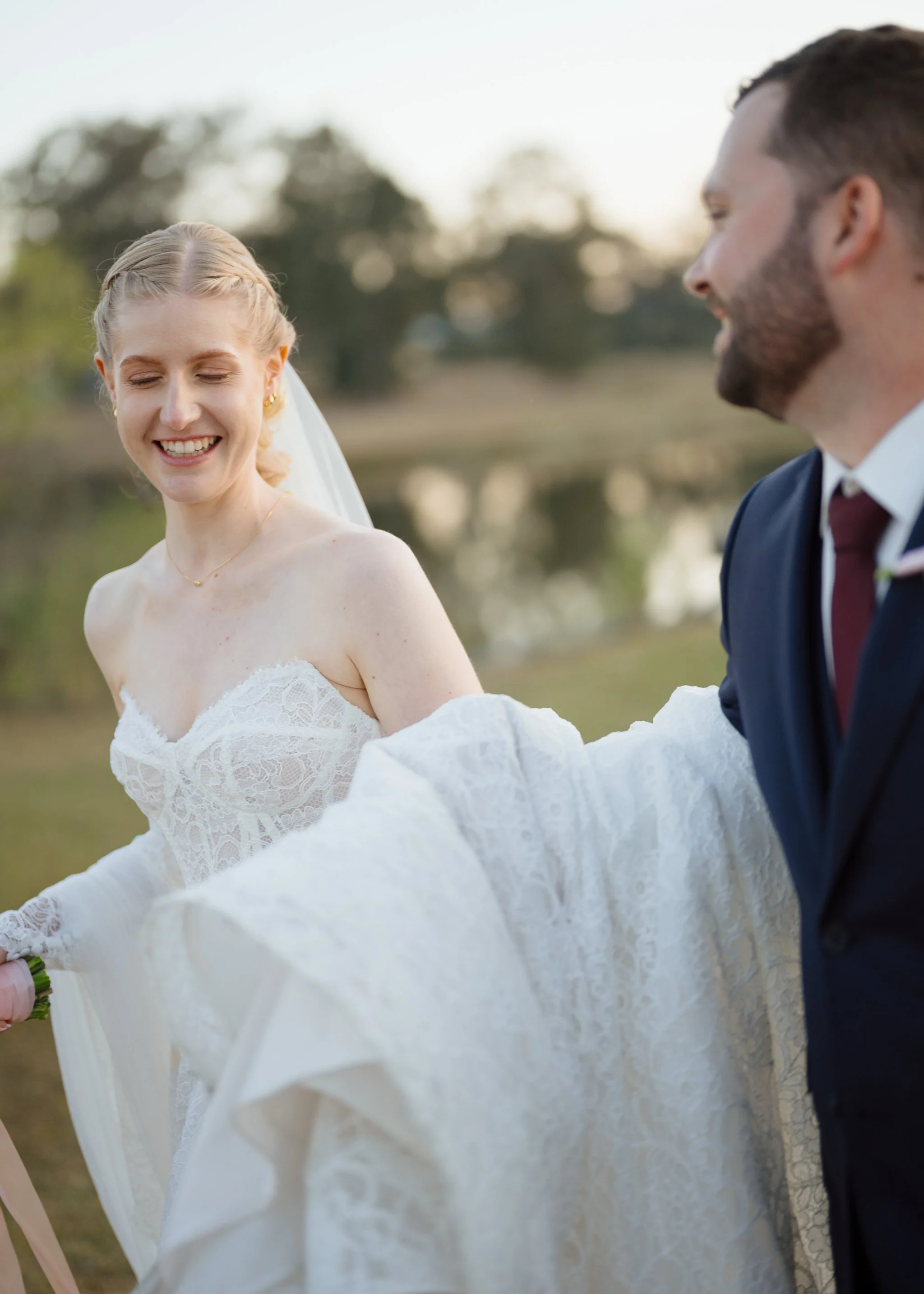 Bride and Groom Sharing a Laugh Outdoors