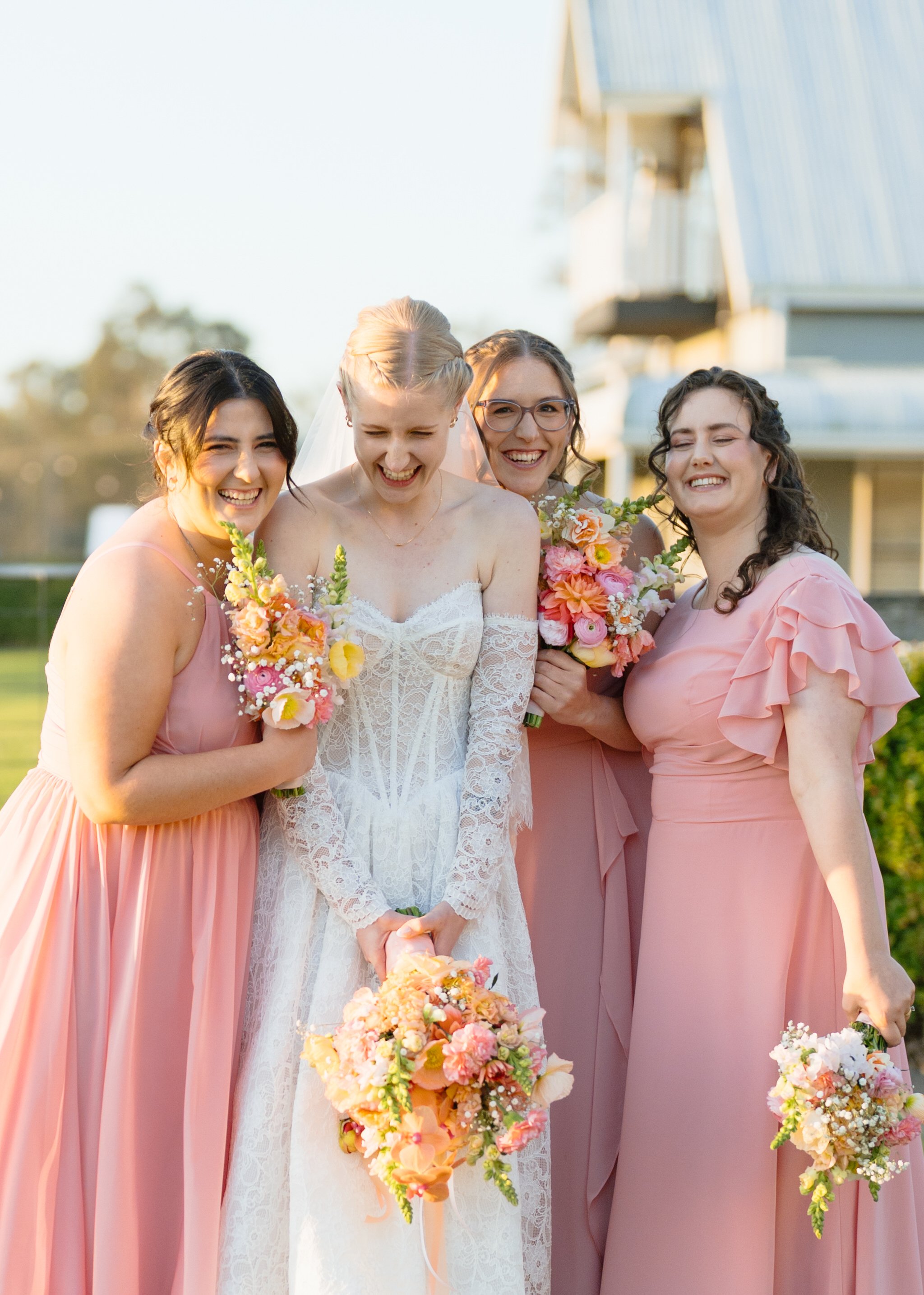 Bride Laughing with Her Bridesmaids