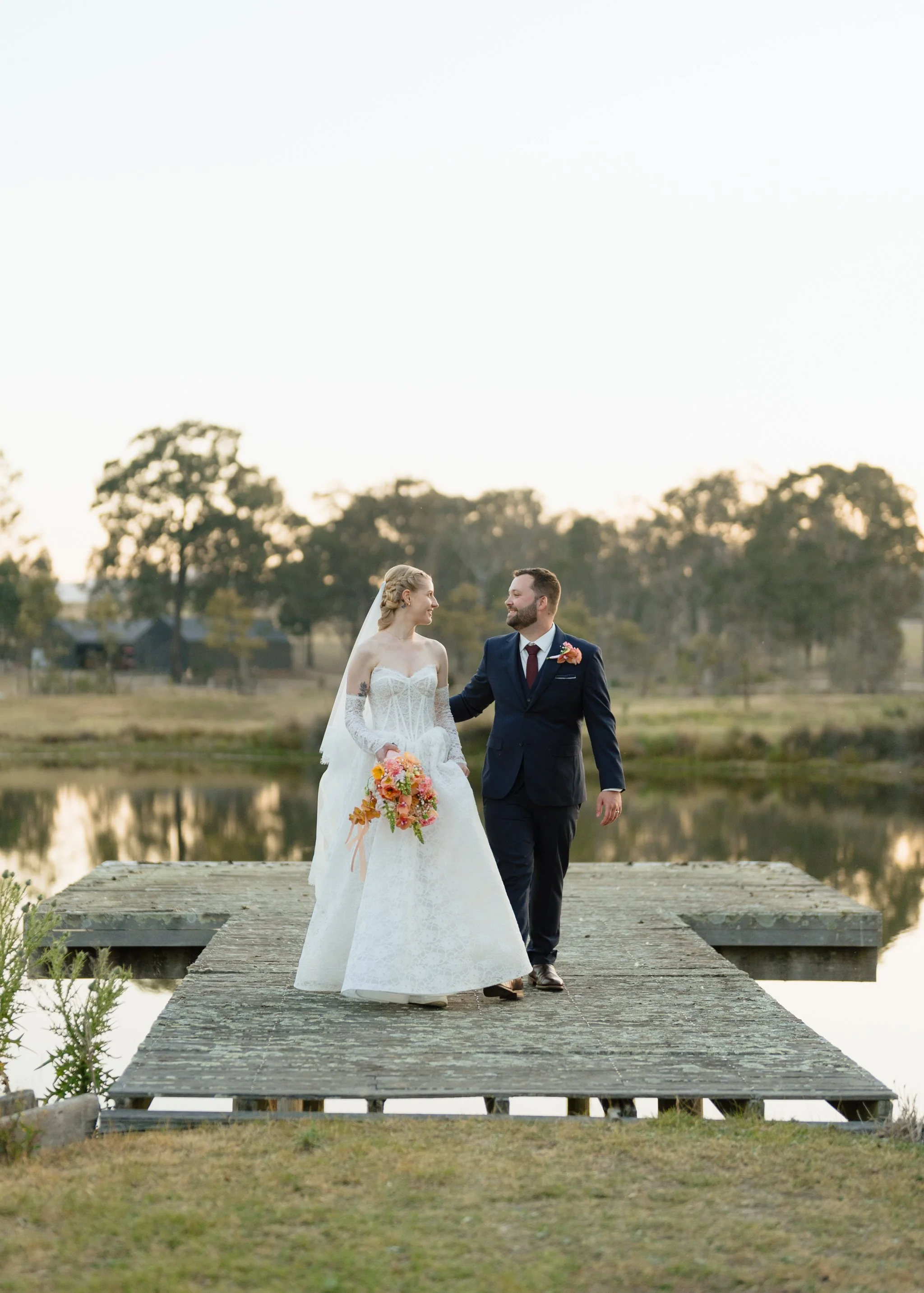 Bride and Groom Walking on the Jetty
