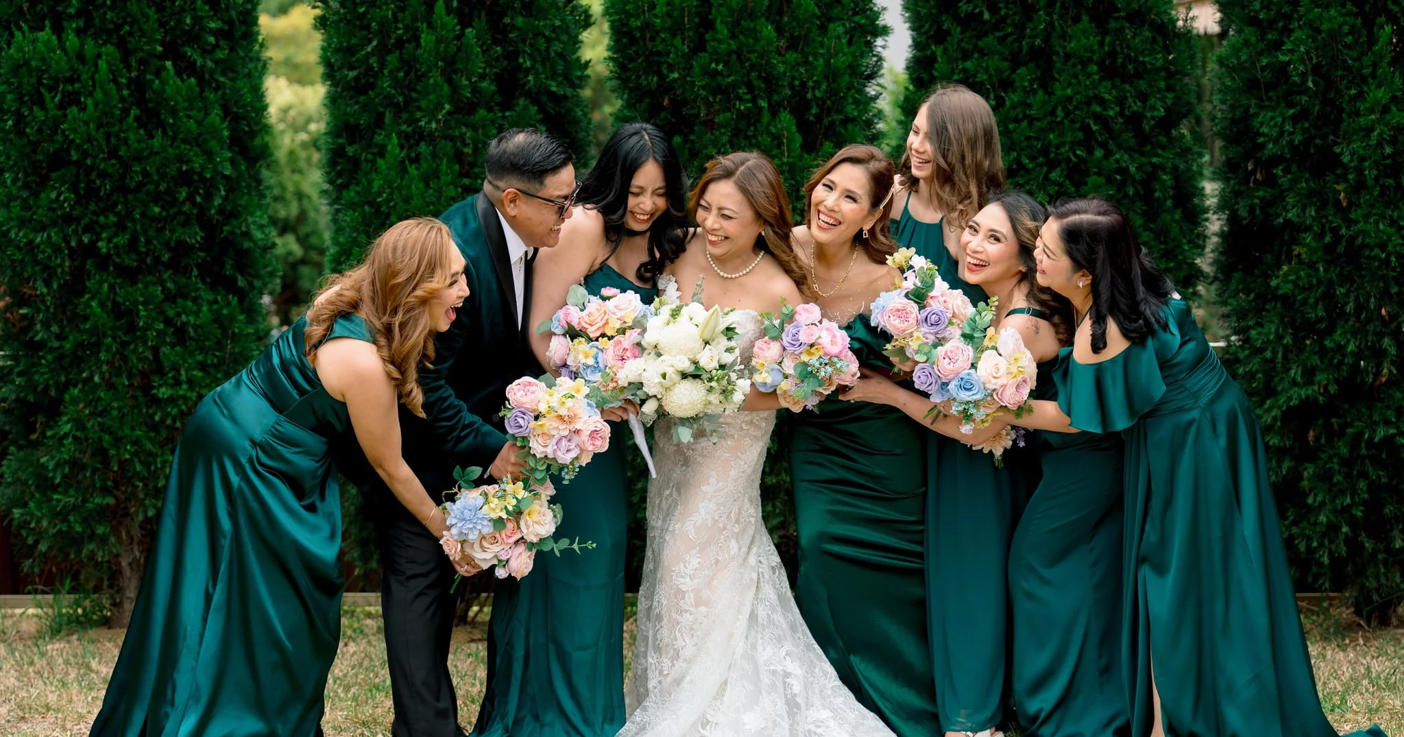 Bride with bridesmaids holding bouquets at Angelo’s Cabarita
