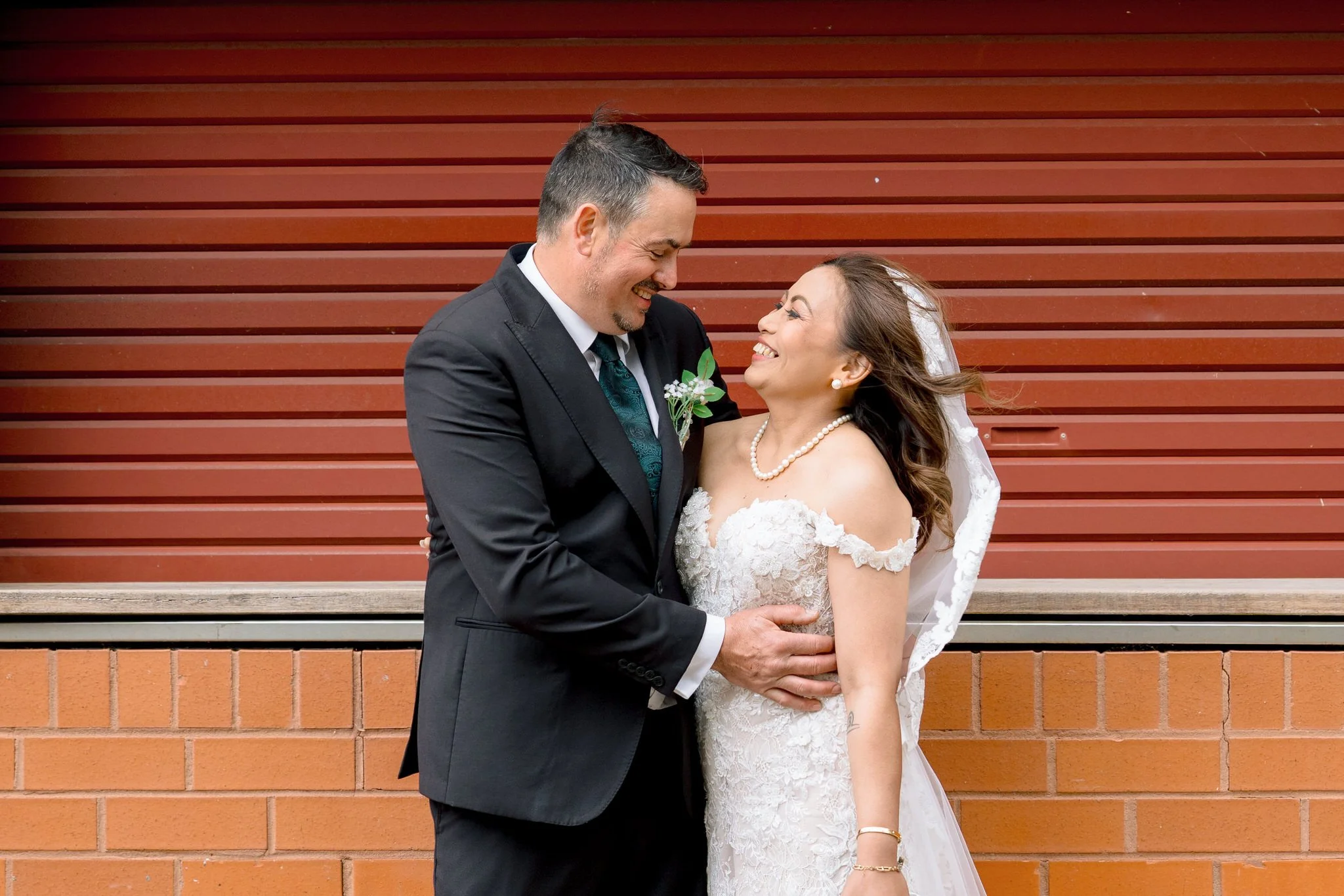 Bride and groom laughing during Angelo’s Cabarita wedding