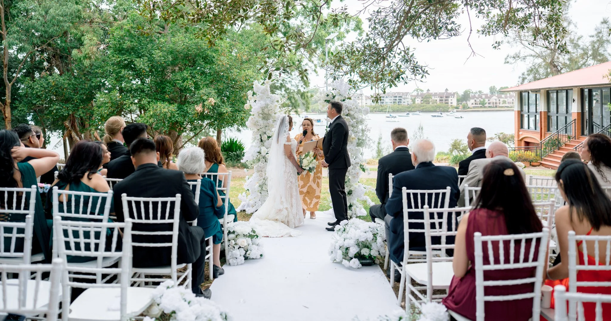 Outdoor wedding ceremony at Angelo’s Cabarita with guests seated