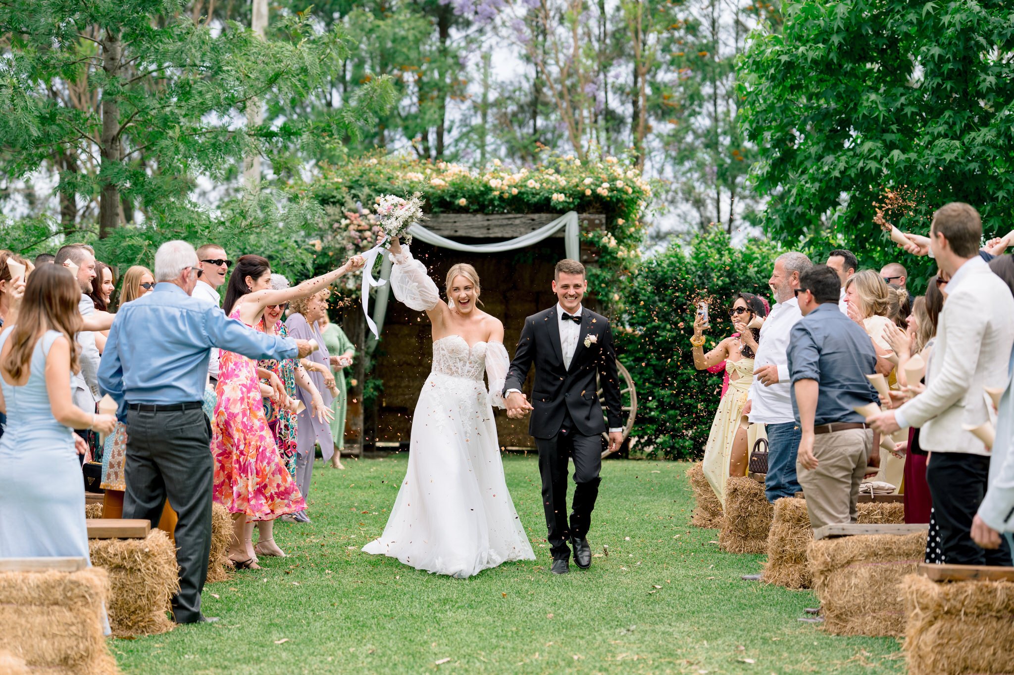 At the Bolwarra Farm, wedding ceremony exit of the newly-wed couple photograph by Hunter Valley Photographer, Firstlook Stills.