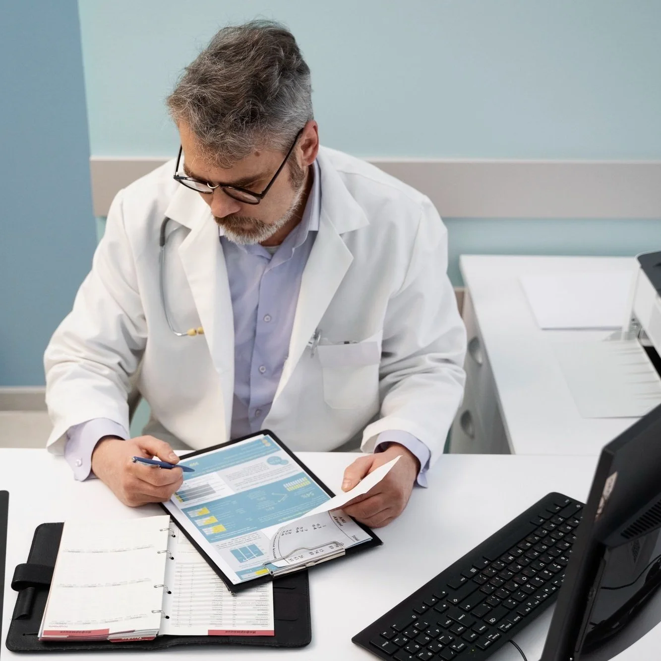 medium-shot-doctor-filling-document-high-angle.jpg