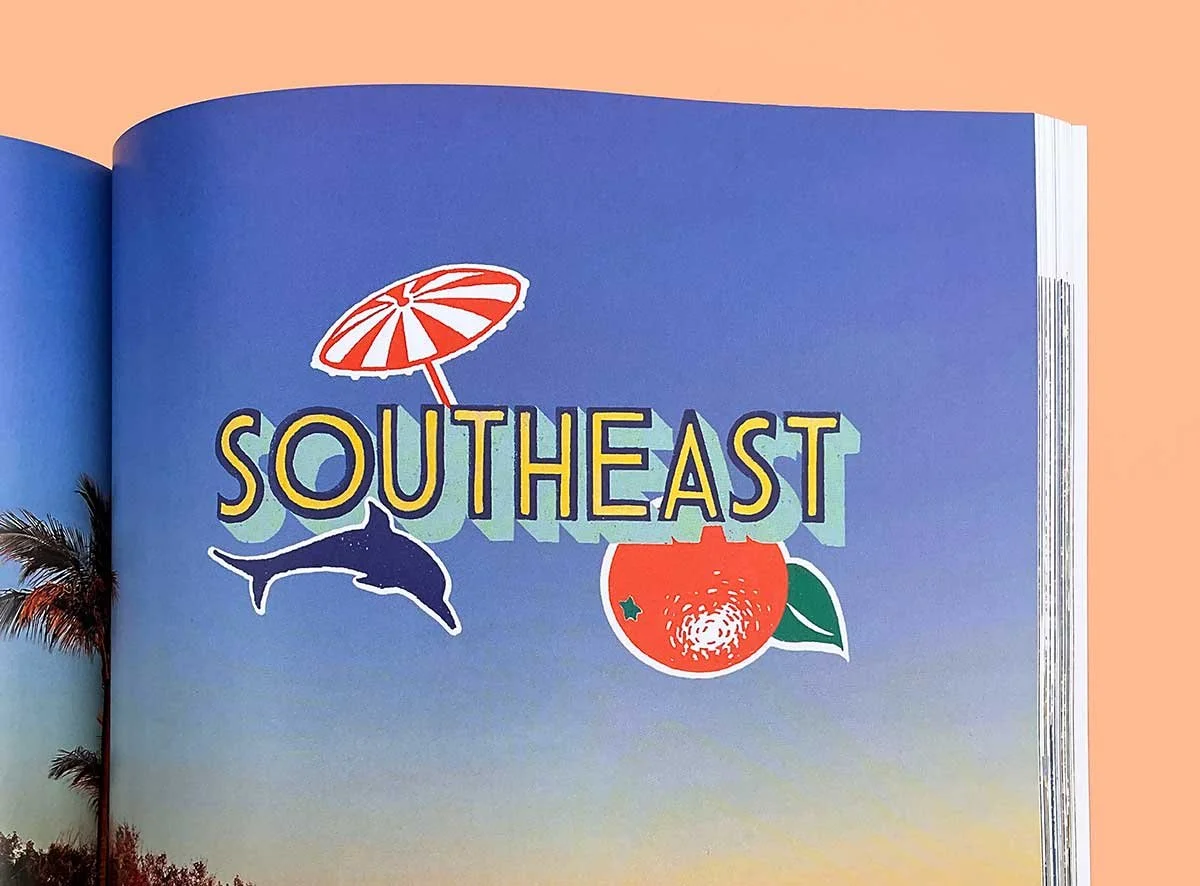 Open book showing a title page featuring hand lettered “SOUTHEAST” in yellow and turquoise by Anna Simmons. The lettering sits over sticker-style illustrations, including a dolphin, an orange, and a parasol, set against a bright blue sky background.