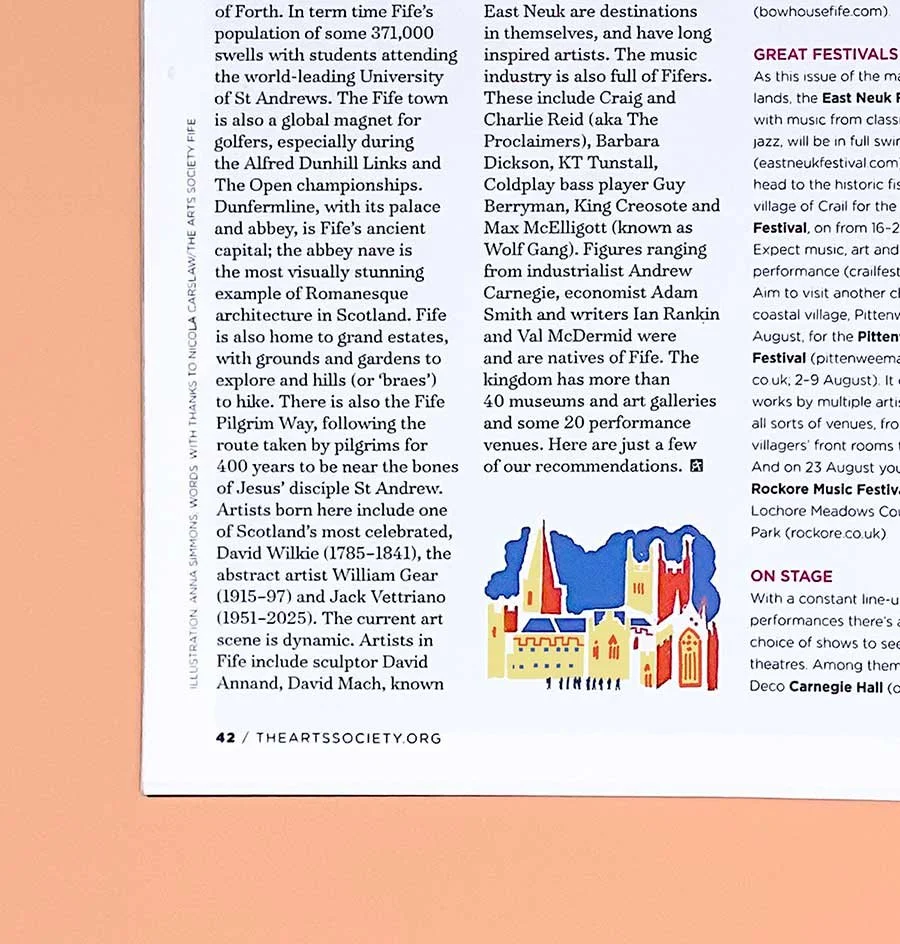 Photograph of the corner of the Arts Society Magazine showing a spot illustration of Dunfermline Abbey in blue, red and yellow, surrounded by accompanying type