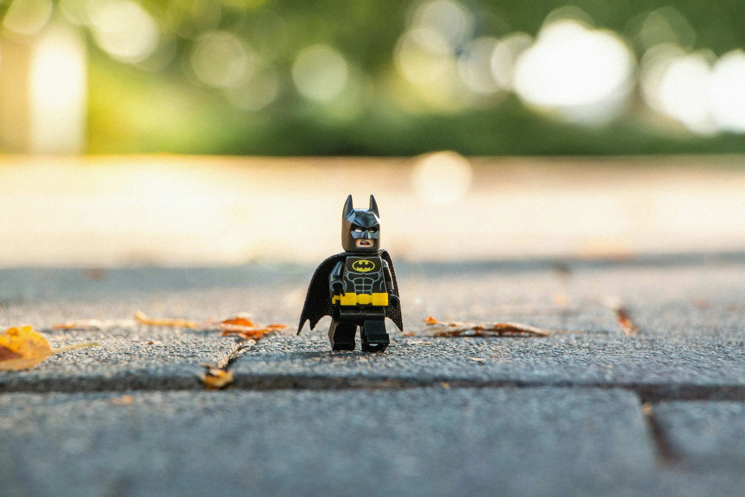 A Batman superhero Lego figure standing heroically on a pavement, symbolising the unique and distinctive qualities that make a brand’s voice stand out