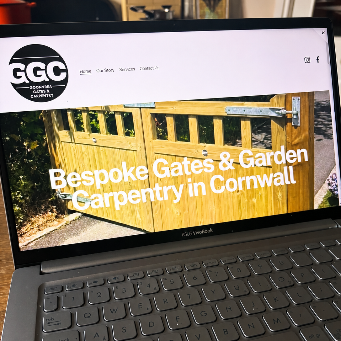 Laptop screen displays a website for GGC Goonvrean Gates & Carpentry featuring a picture of a custom wooden garden gate and the headline, 'Bespoke Gates & Garden Carpentry in Cornwall'.