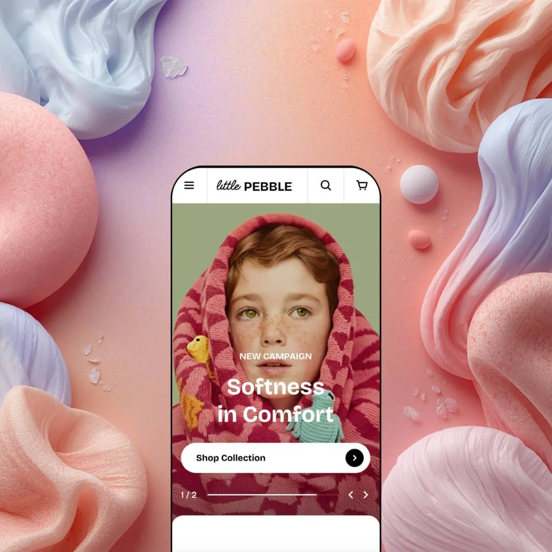 Pebble Shopify theme Pebble preset displayed on a mobile phone, showing the "Softness in Comfort" hero section with a children's fashion storefront layout