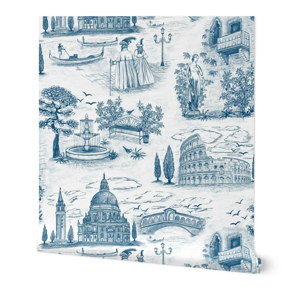 A decorative fabric featuring a blue and white pattern of famous landmarks and scenes from Italy, including gondolas on a canal, the Colosseum, St. Peter's Basilica, and Italian statues, trees, and street scenes.