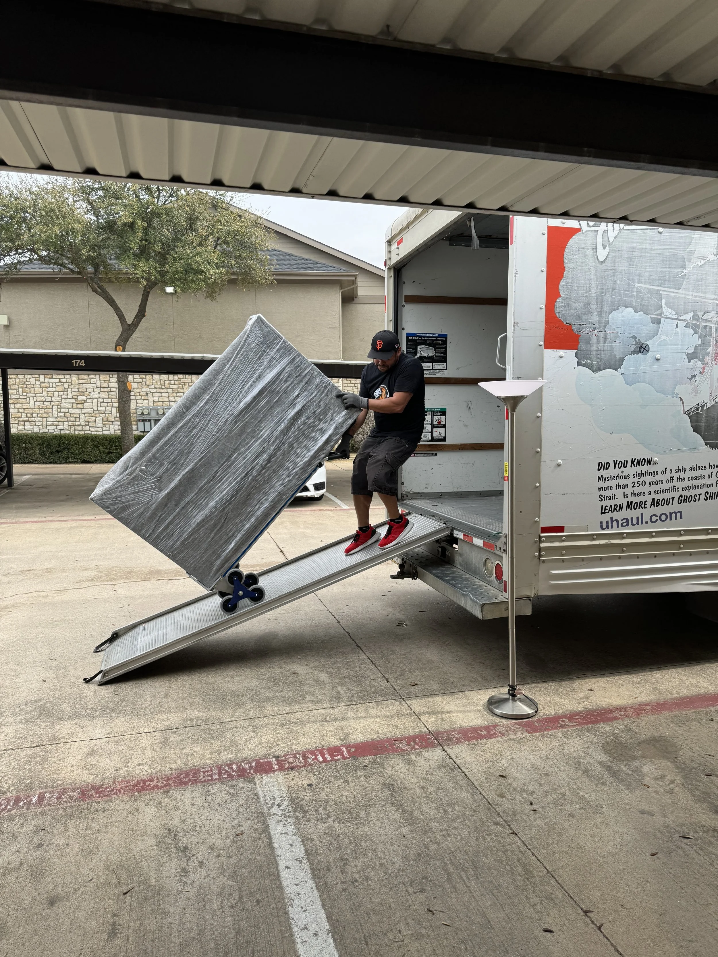 120 Mover loading furniture onto moving truck