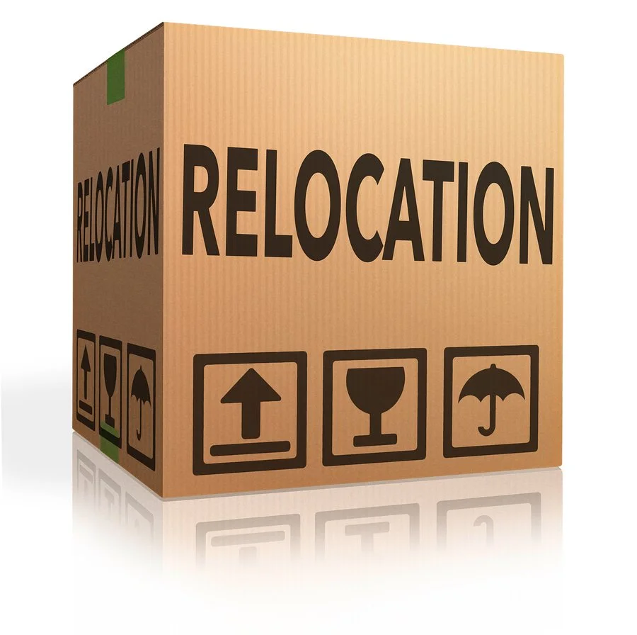 Cardboard moving box labeled relocation representing Dallas relocation services and moving assistance with PJ Zaji Realtor