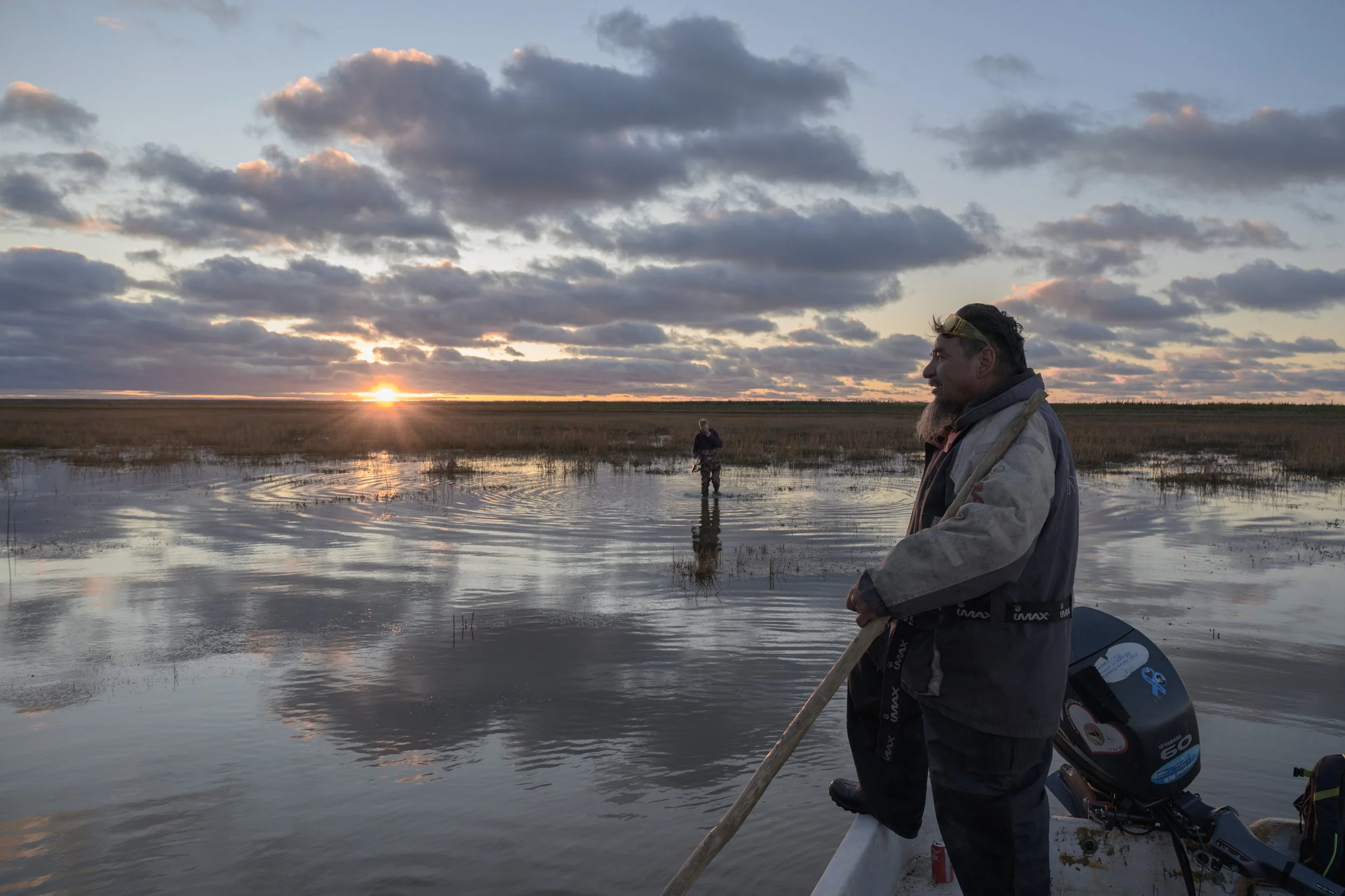 Boat captain waits at the end of the day as the biologist returns from fieldwork. 