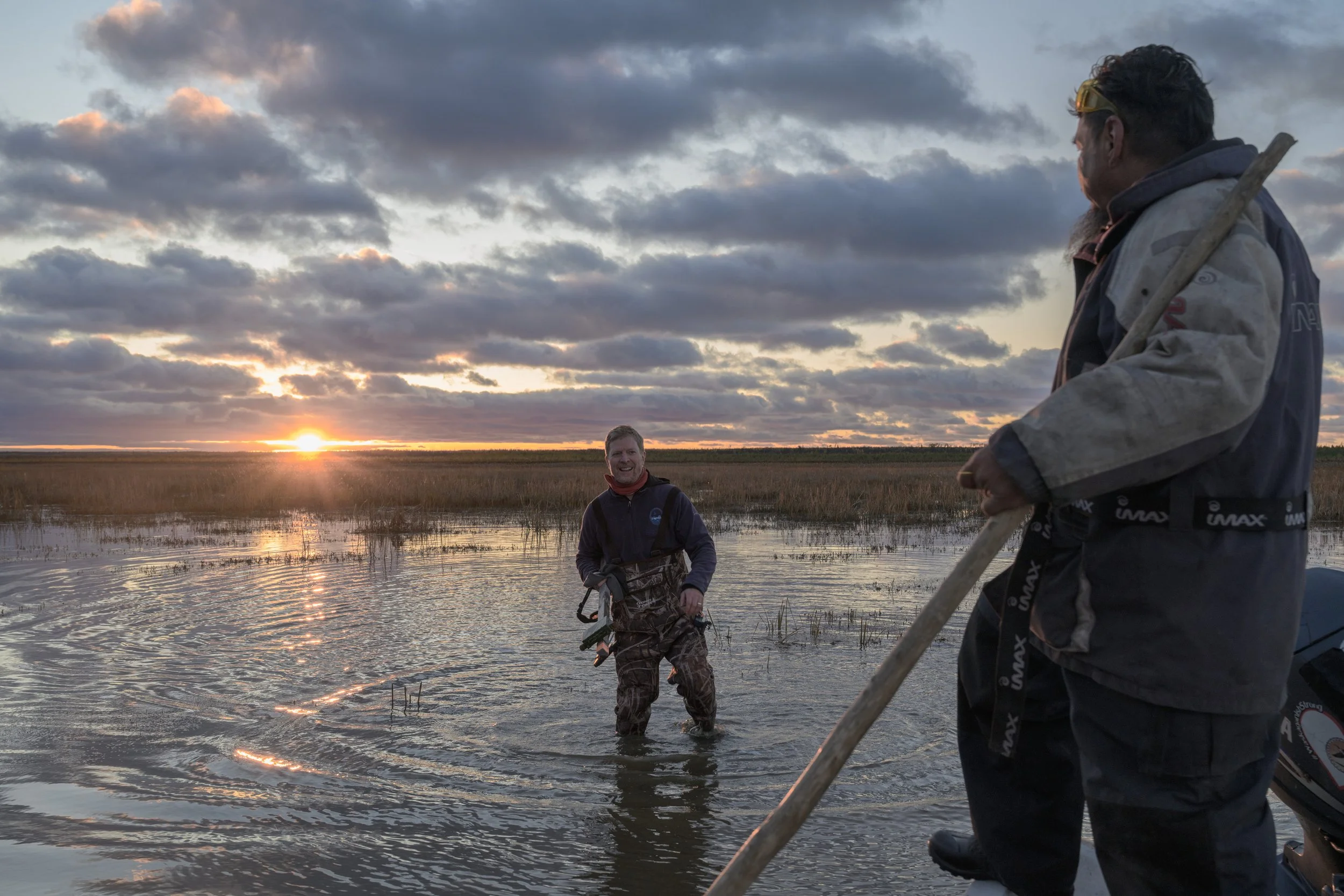 Boat captain waits at the end of the day as the biologist returns from fieldwork. 
