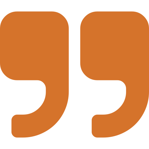 Close-up of open double quotation marks in brown color.