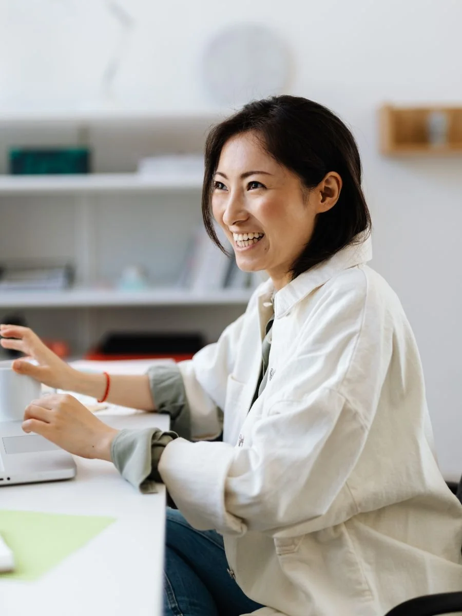 Woman smiling while conversing at work