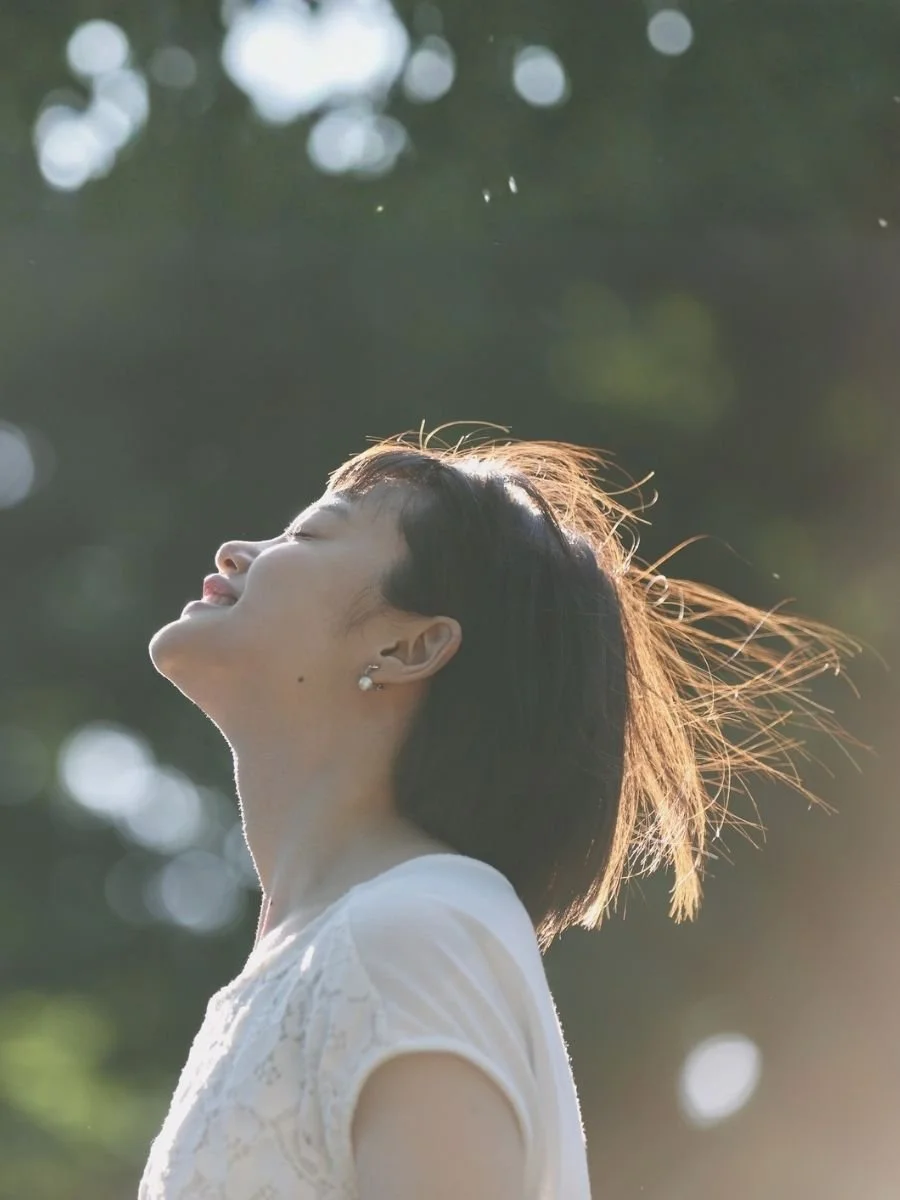 Woman embracing the wind