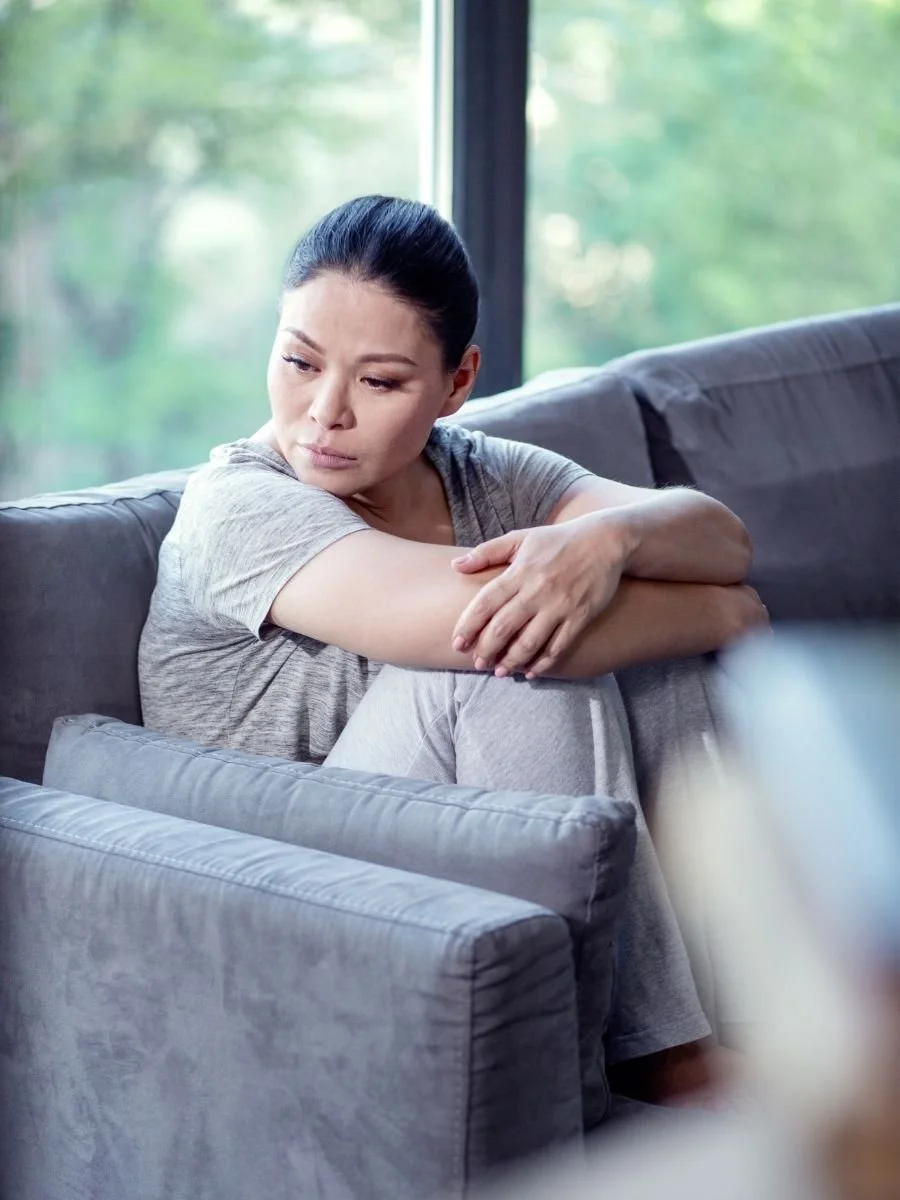 Woman at home alone dealing with conflict avoidance