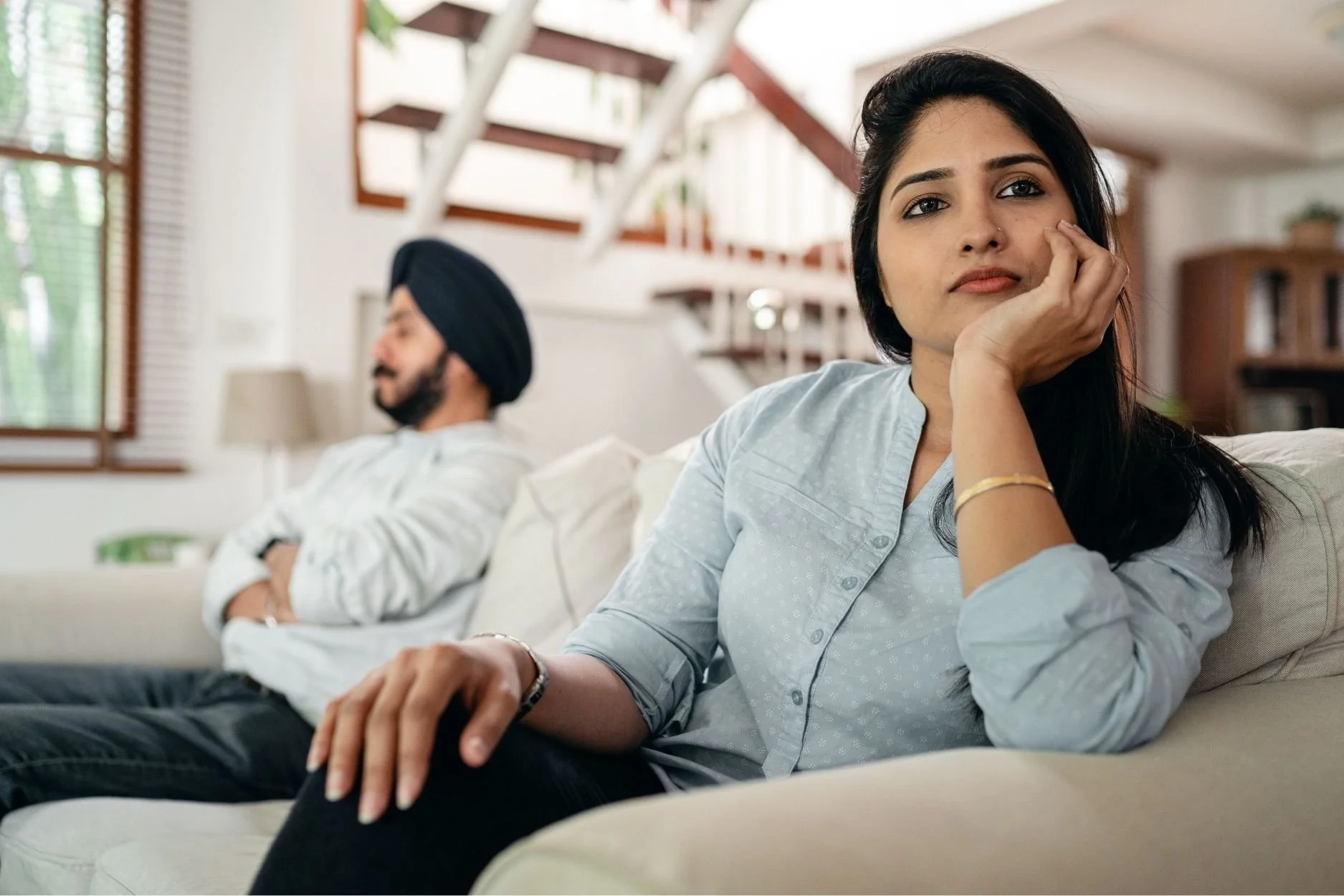 Couple looking away from eachother to avoid conflict