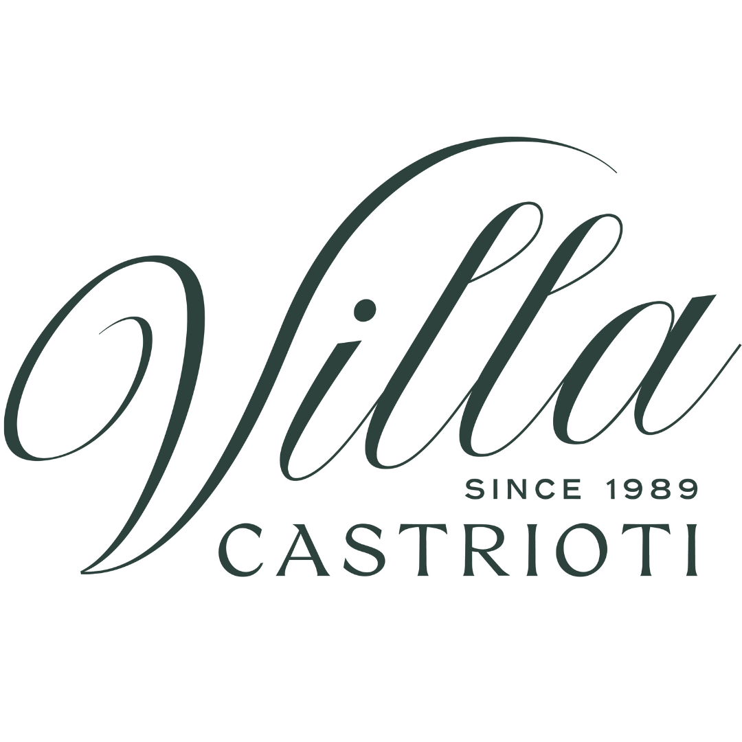 Green Logo for Villa Castrioti with "Villa" in cursive and the text "since 1989" and "Castrioti" 