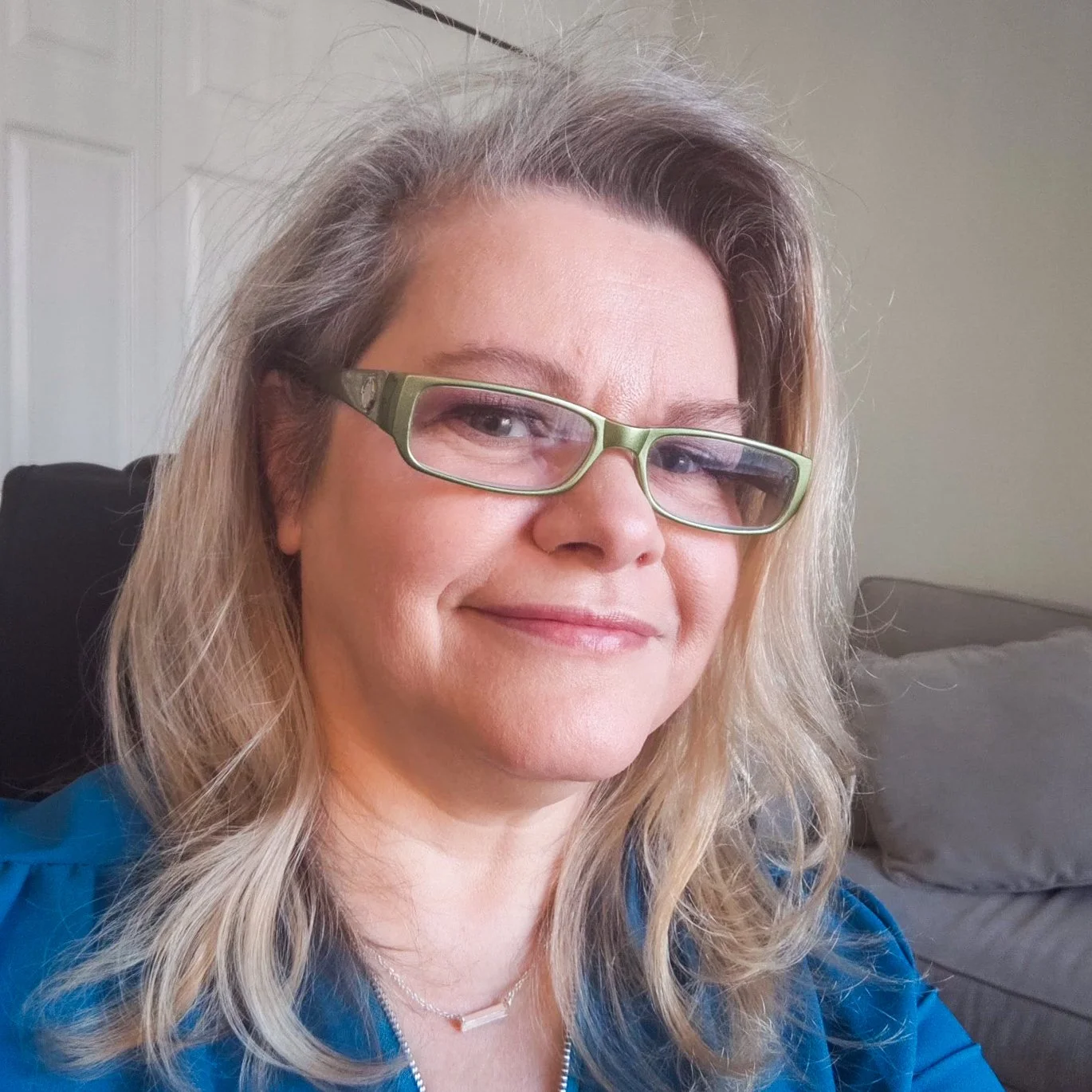 Woman smiling for headshot | Janai Meyer - Alaska's Wellness Studio